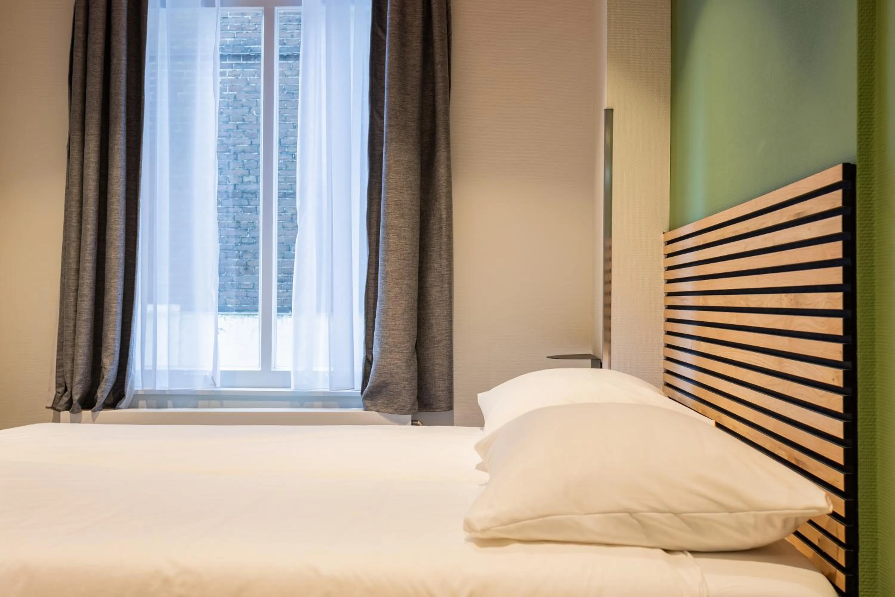 Bed in Weber Hotel 117