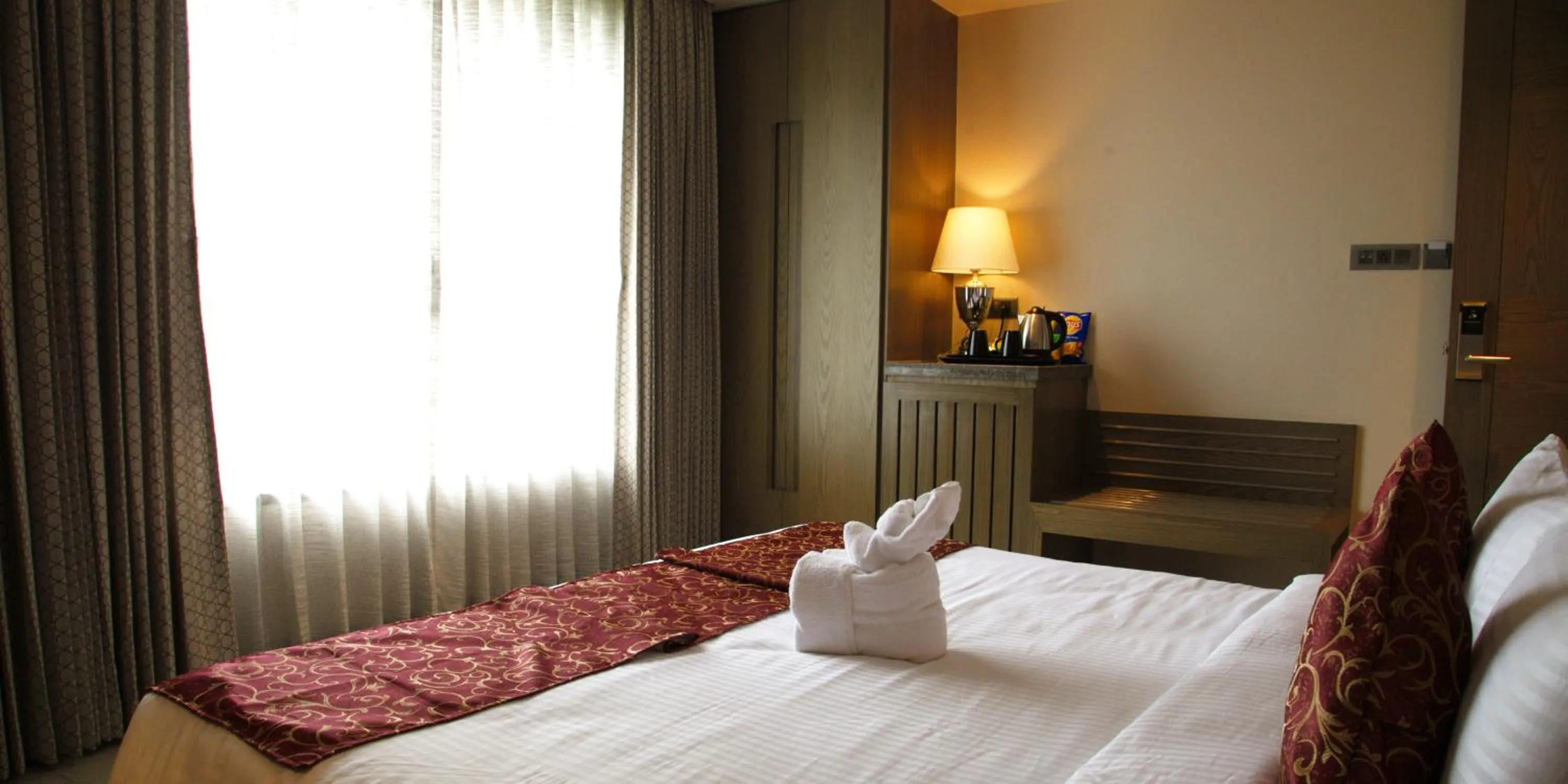 Bed in Hotel Grand Kadamba