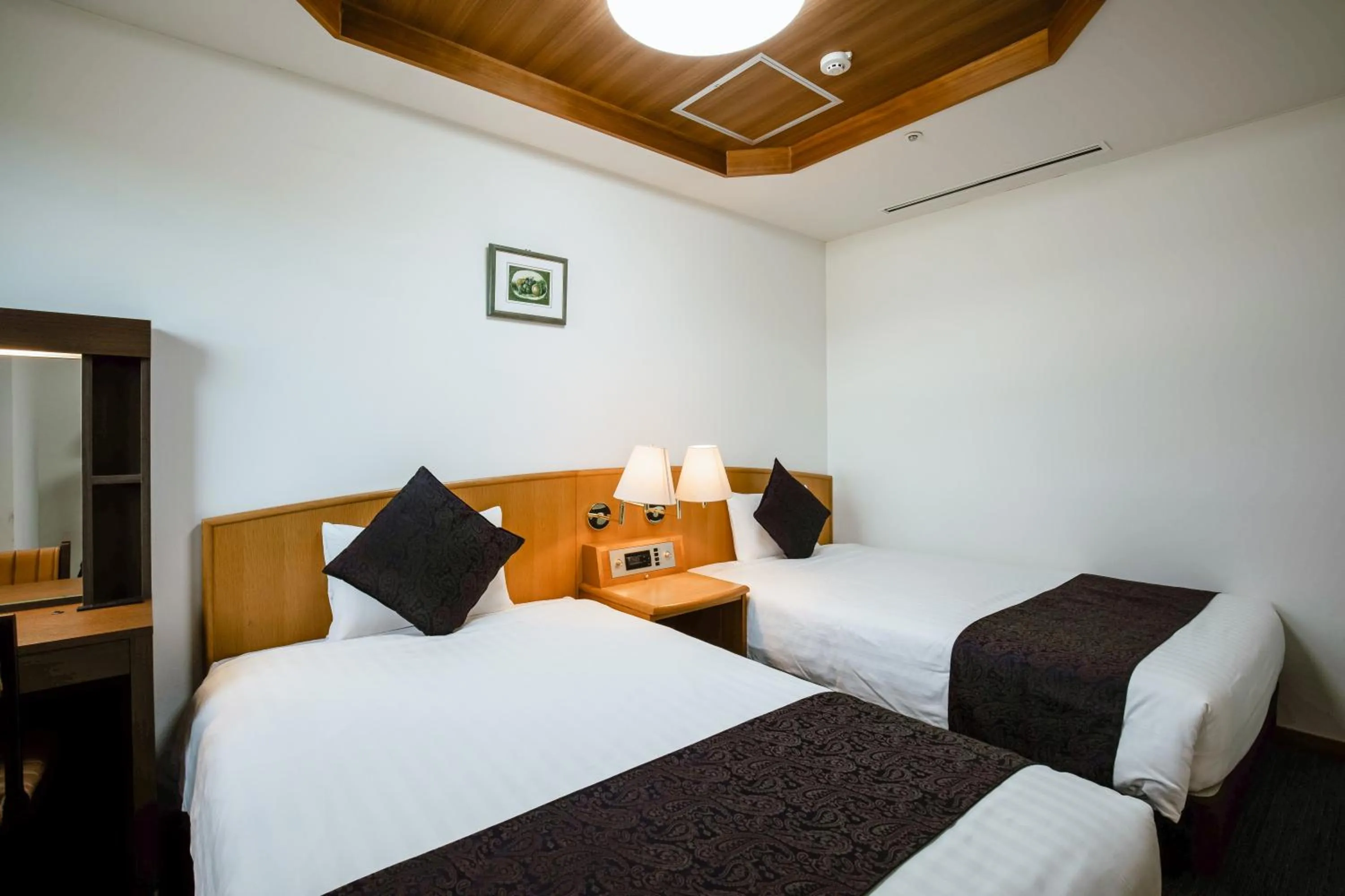 Bed in KAMENOI HOTEL Kochi