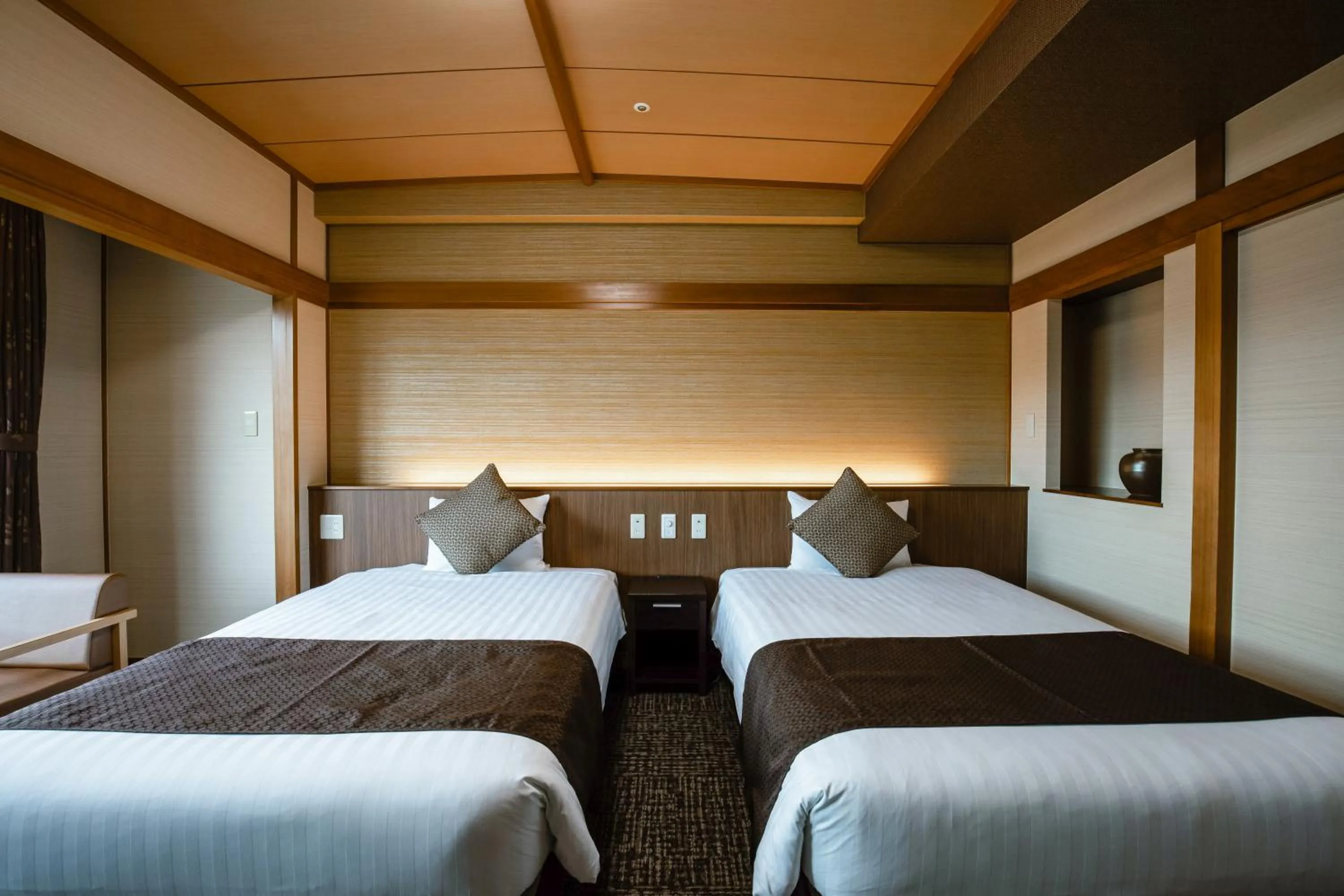 Bed in KAMENOI HOTEL Kochi