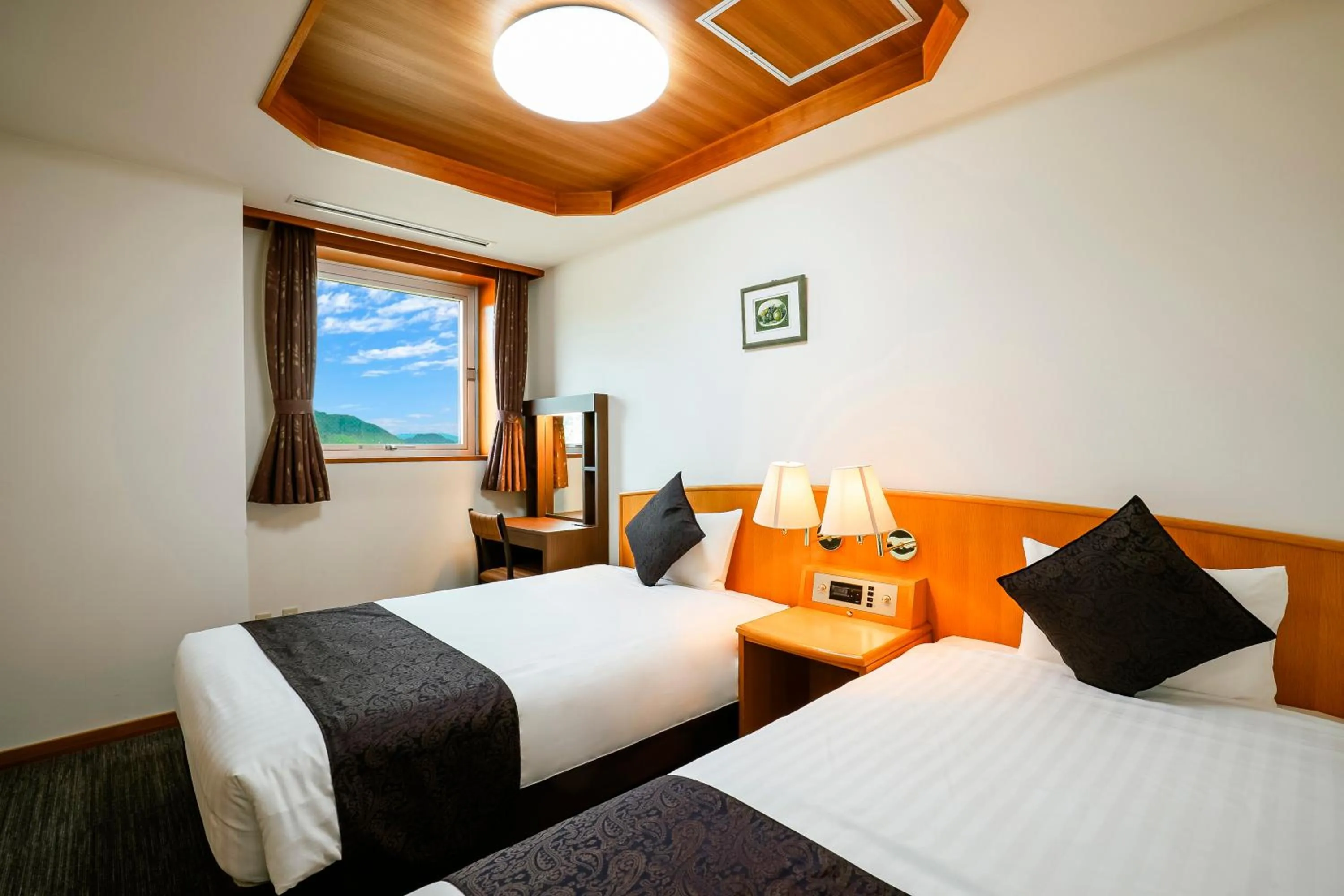 Bed in KAMENOI HOTEL Kochi