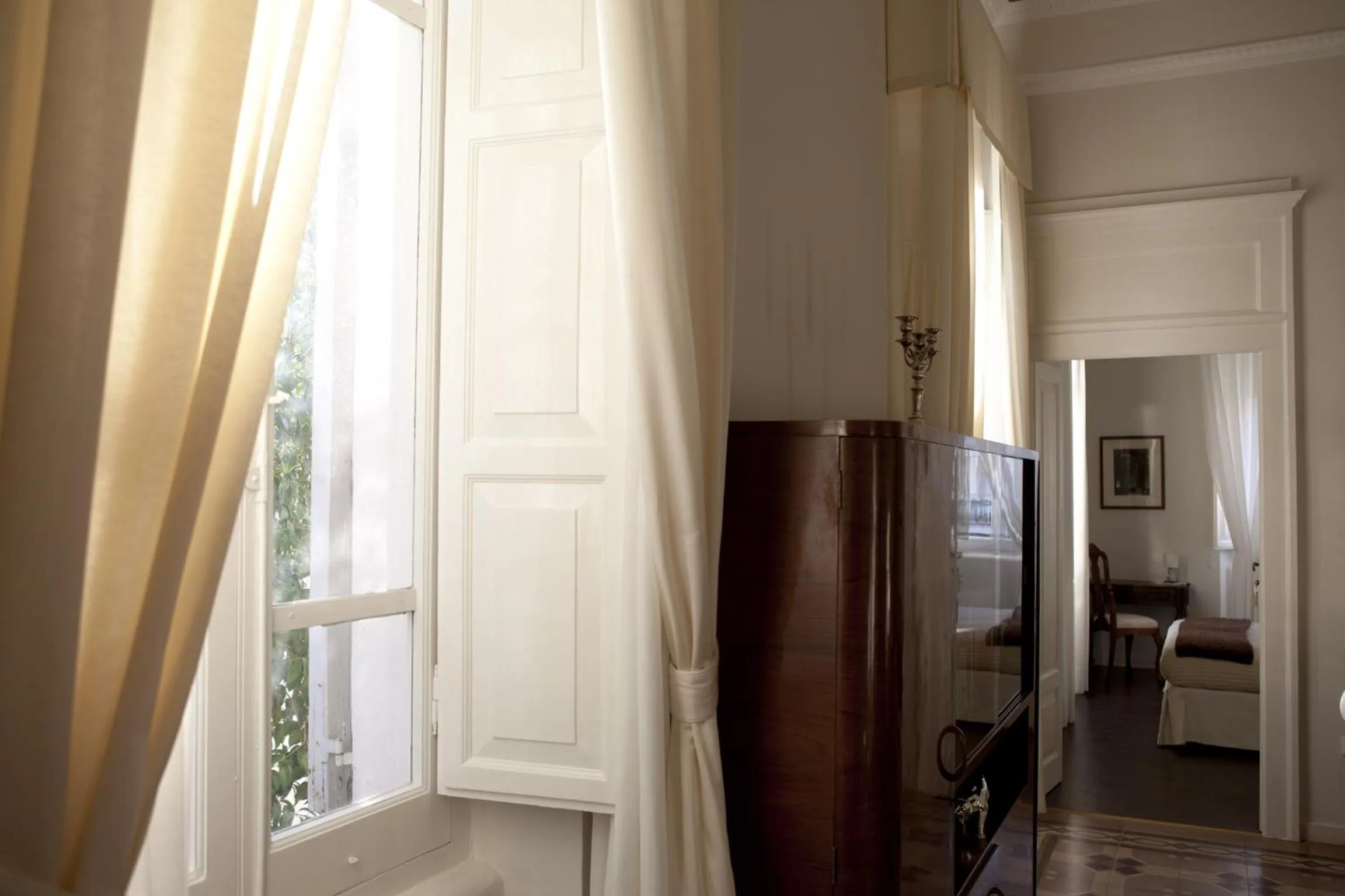 Communal lounge/ TV room in Dimora Novecento