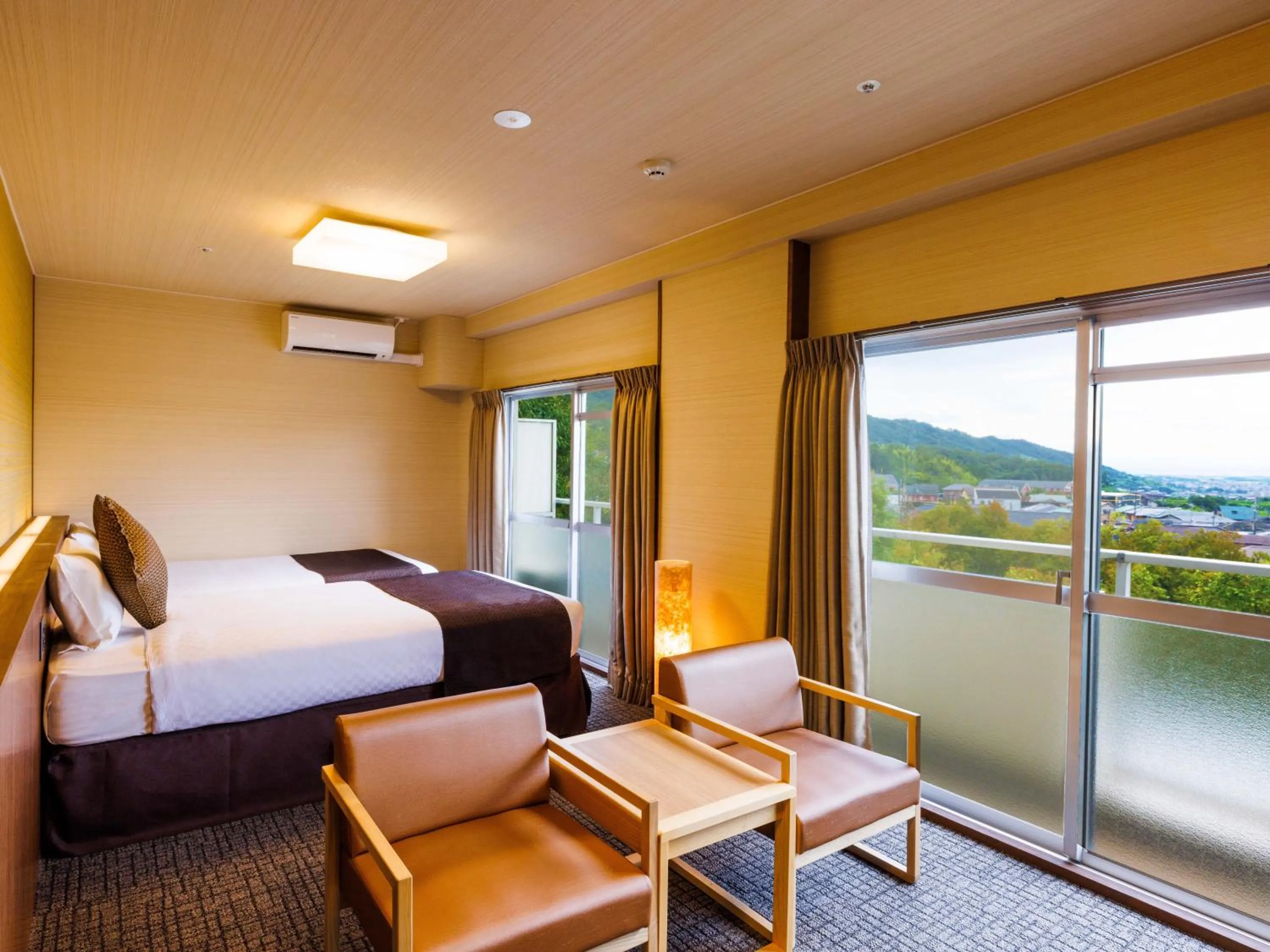 Bed in KAMENOI HOTEL Yamato Heguri