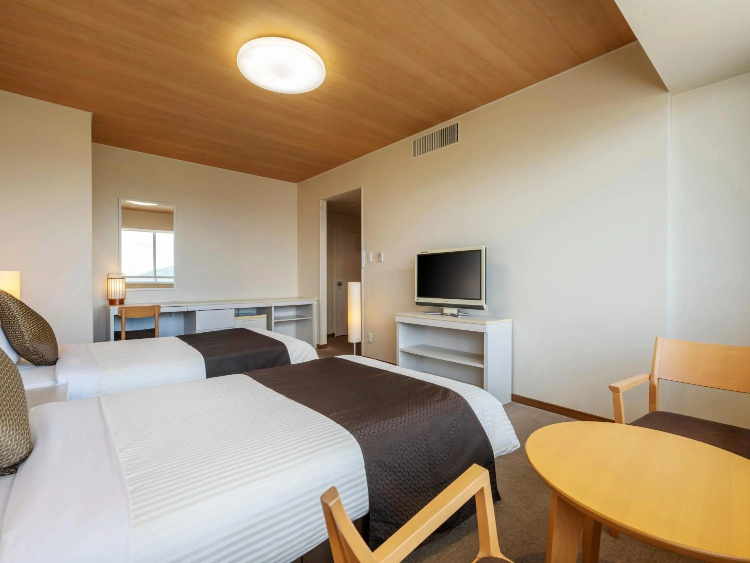 Bed in KAMENOI HOTEL Yamato Heguri