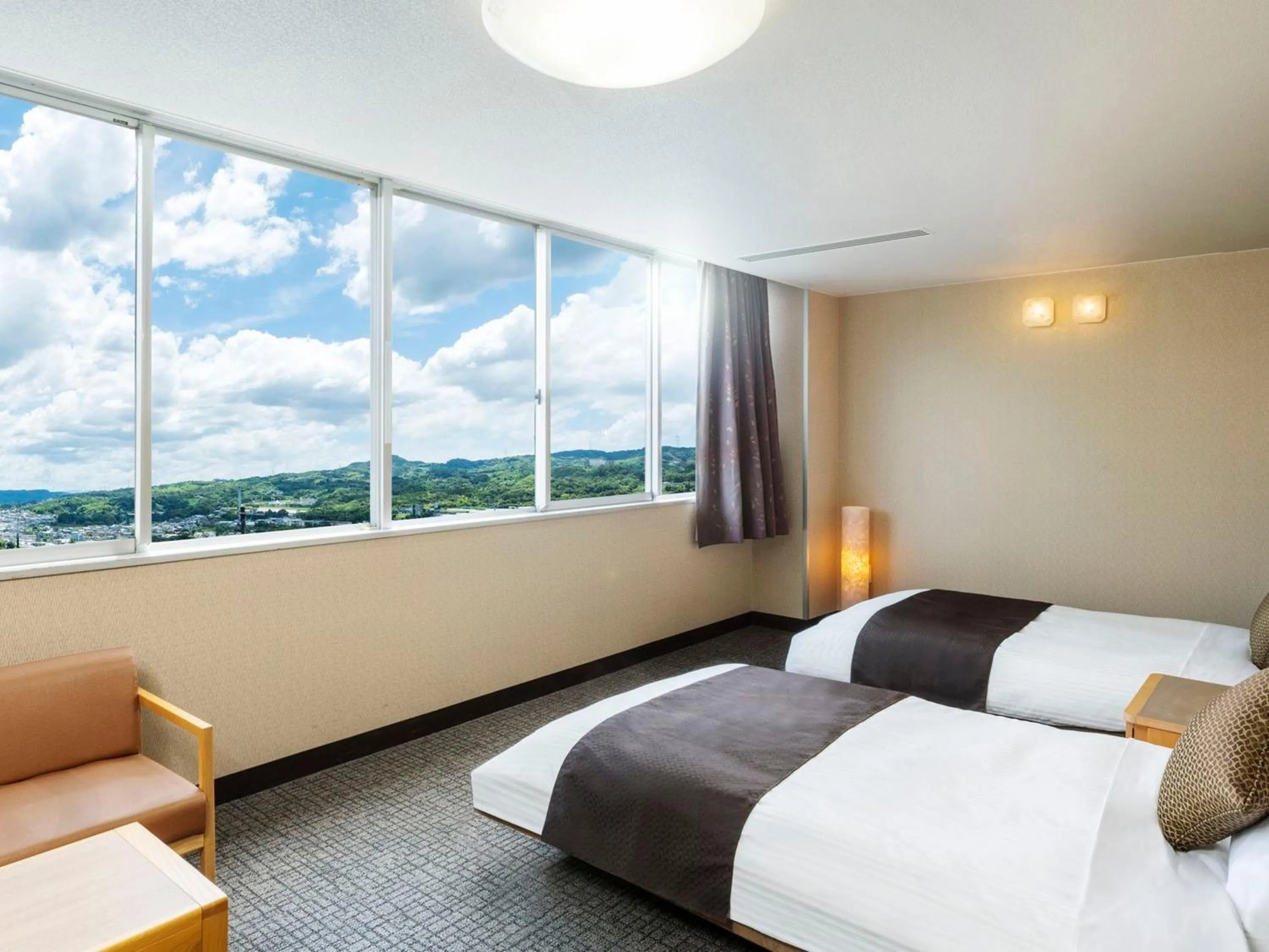 Photo of the whole room, Bed in KAMENOI HOTEL Yamato Heguri