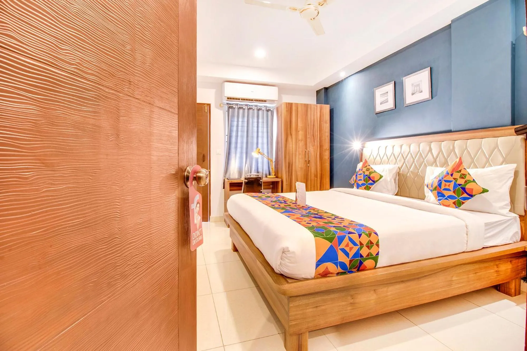 Seating area, Bed in Hotel The Sun Suites - Yelahanka