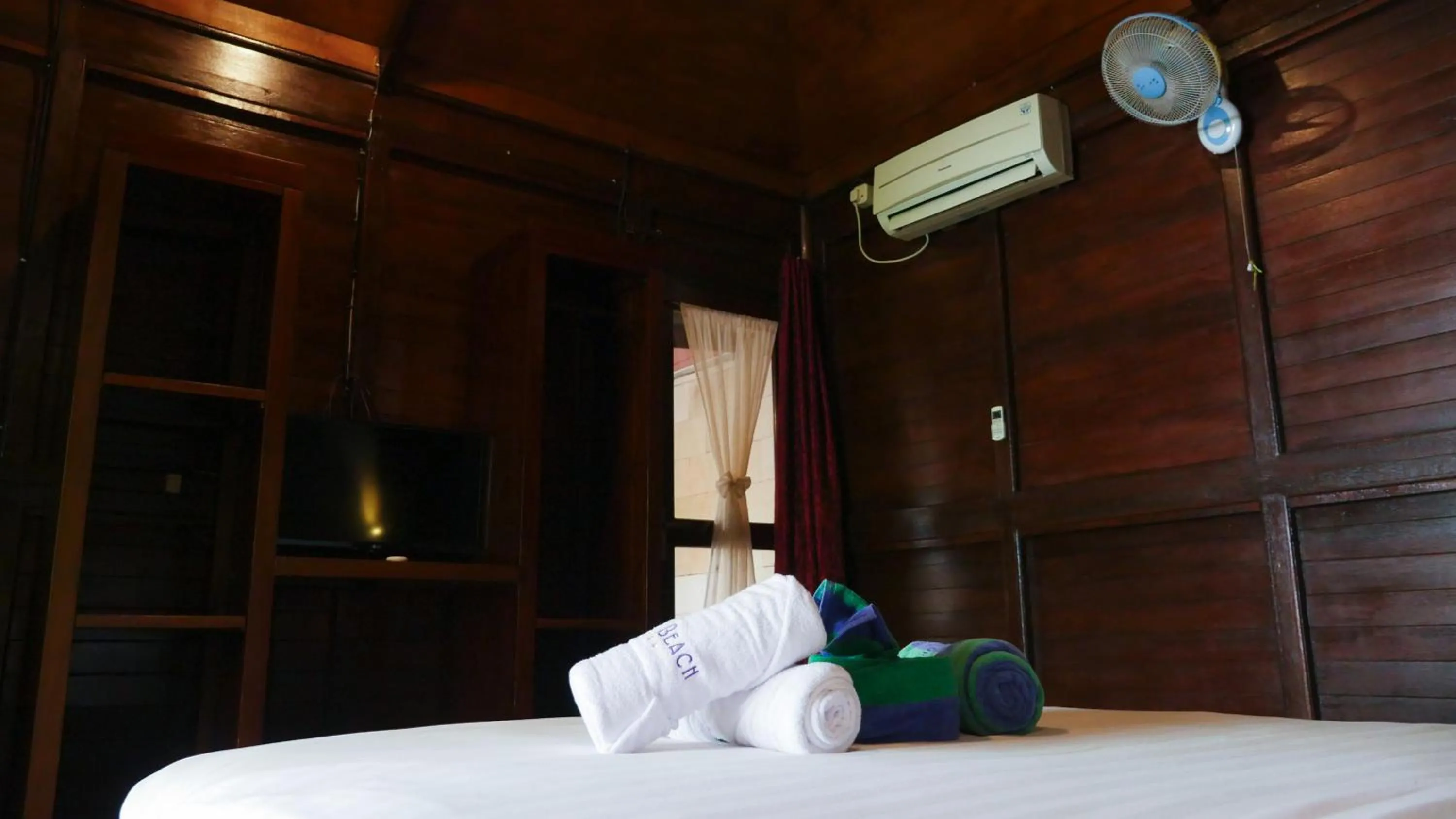 Bed in Turtle Garden Hotel