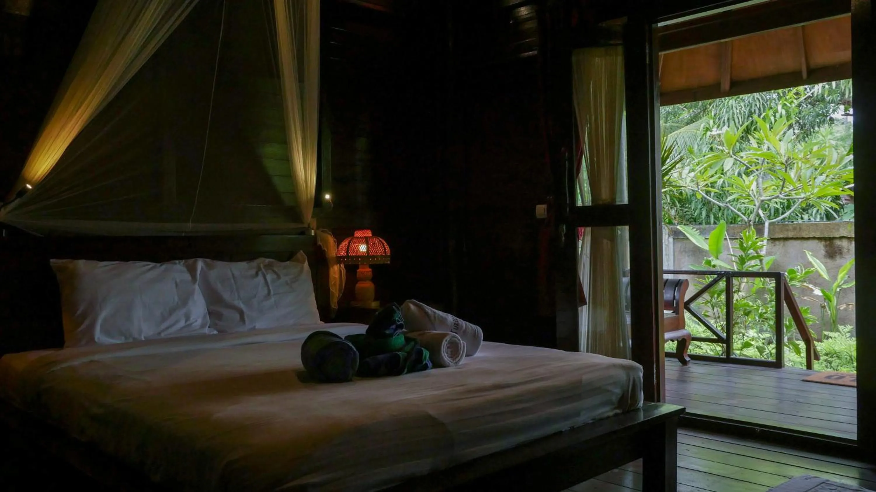 Bed in Turtle Garden Hotel