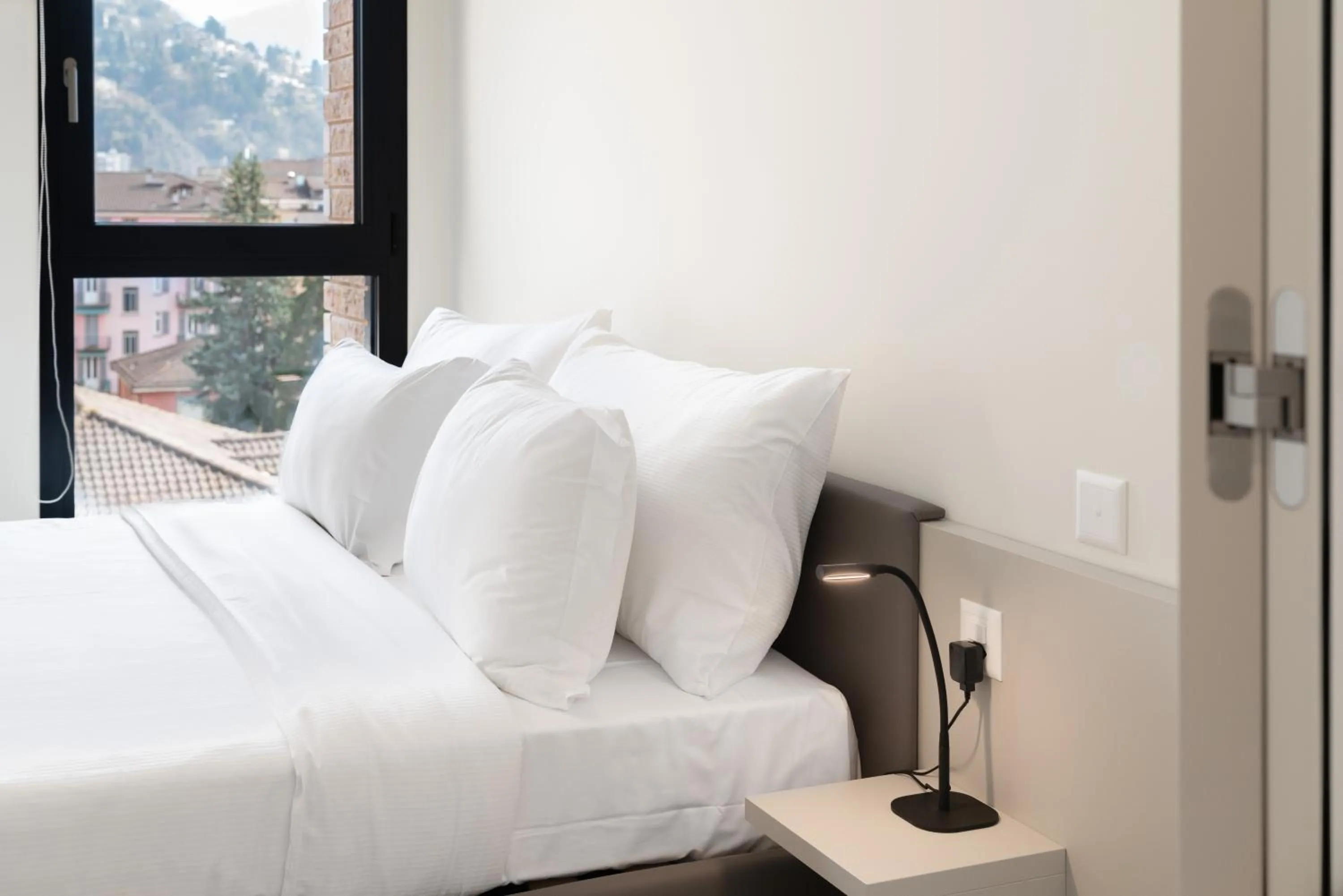 Bed in Swiss Hotel Apartments - Lugano