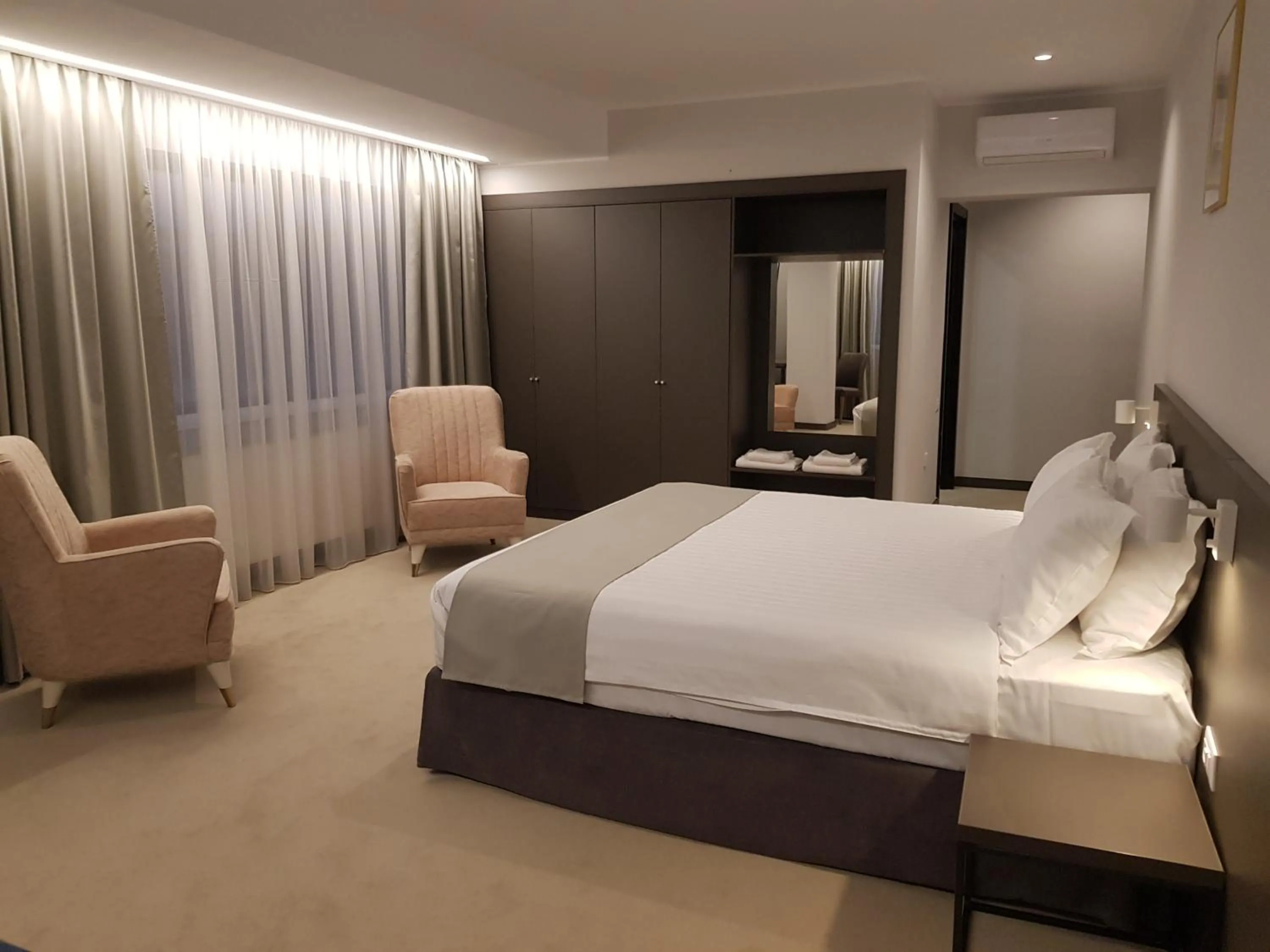 Photo of the whole room, Bed in NOVO Boutique