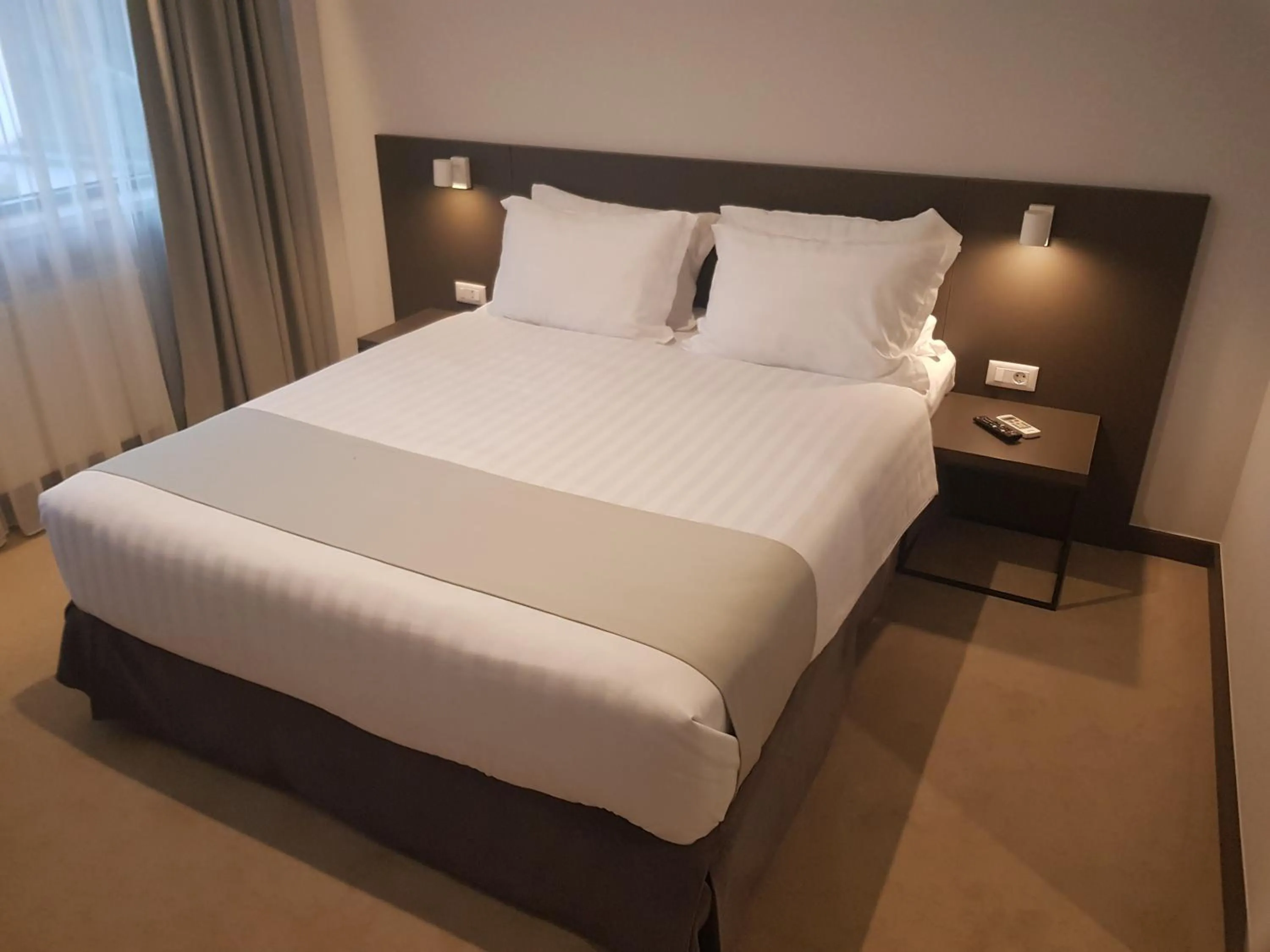 Photo of the whole room, Bed in NOVO Boutique