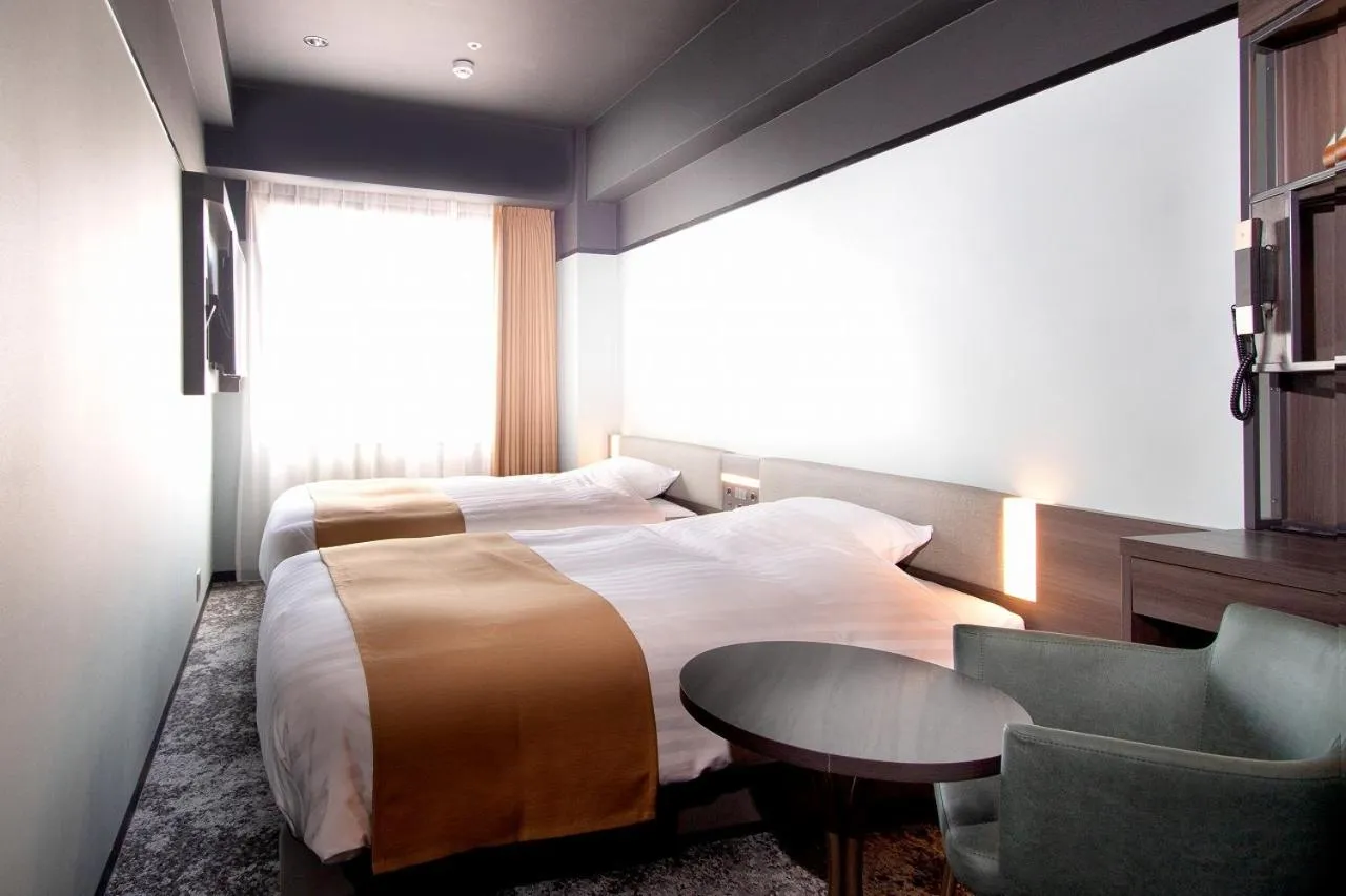 Bed in Kobe Plaza Hotel West