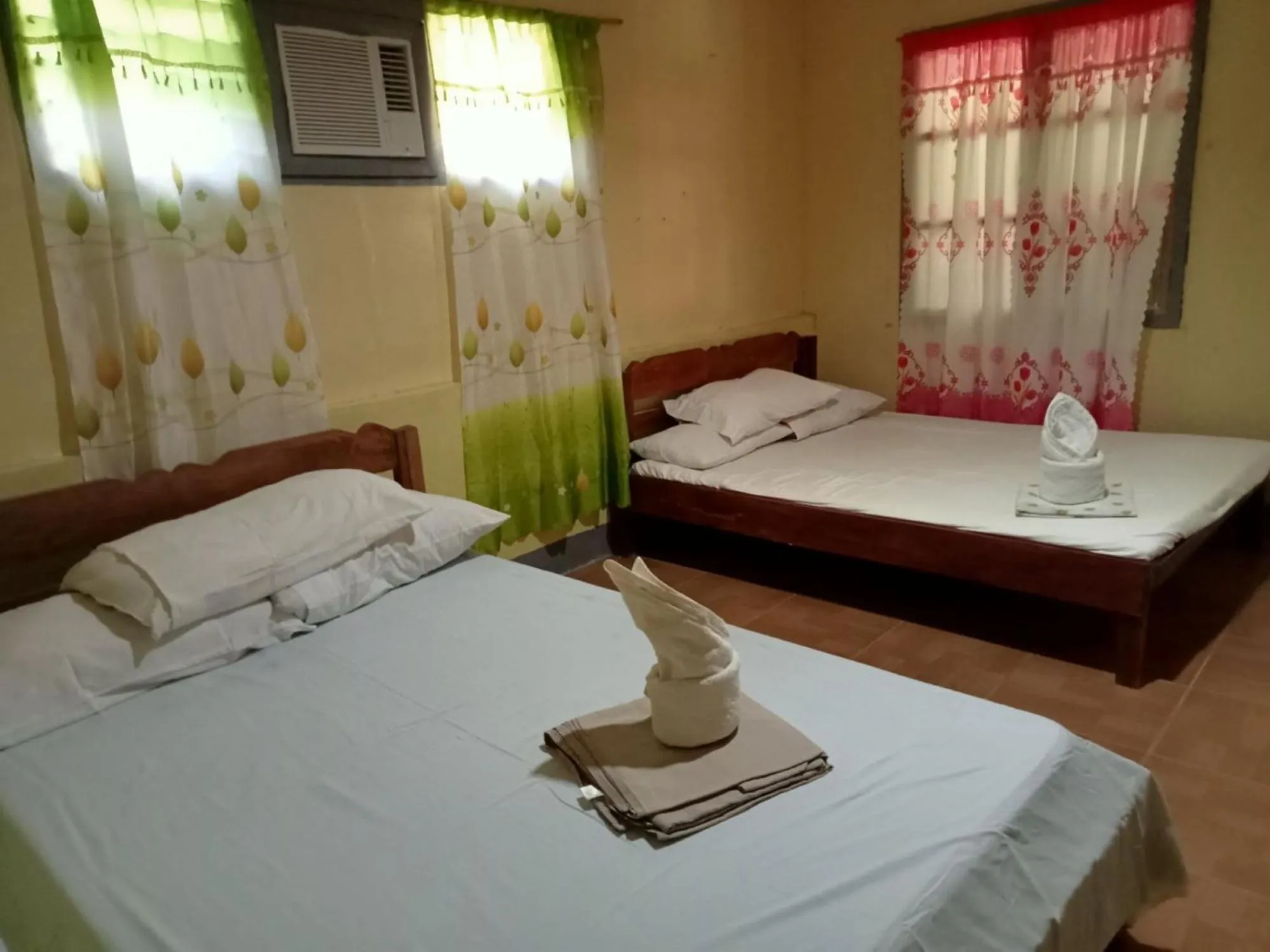 Bed in Basio's Place Tourist Inn by RedDoorz