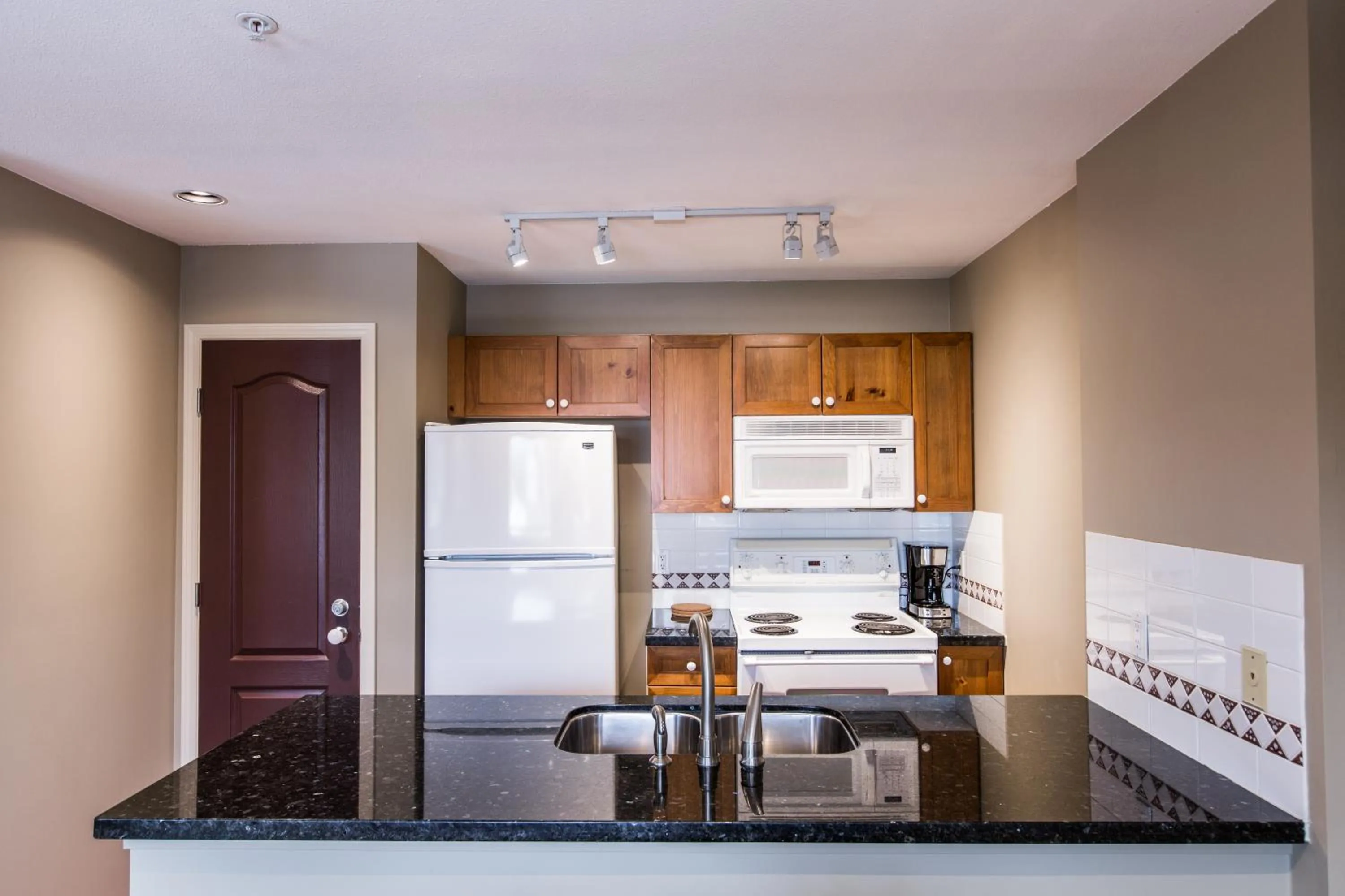 Kitchen or kitchenette in Whistler Blackcomb Vacation Rentals - Village North