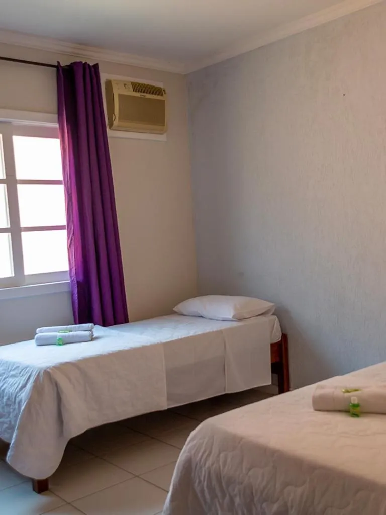 Bed in Pousada Estrada do Ouro