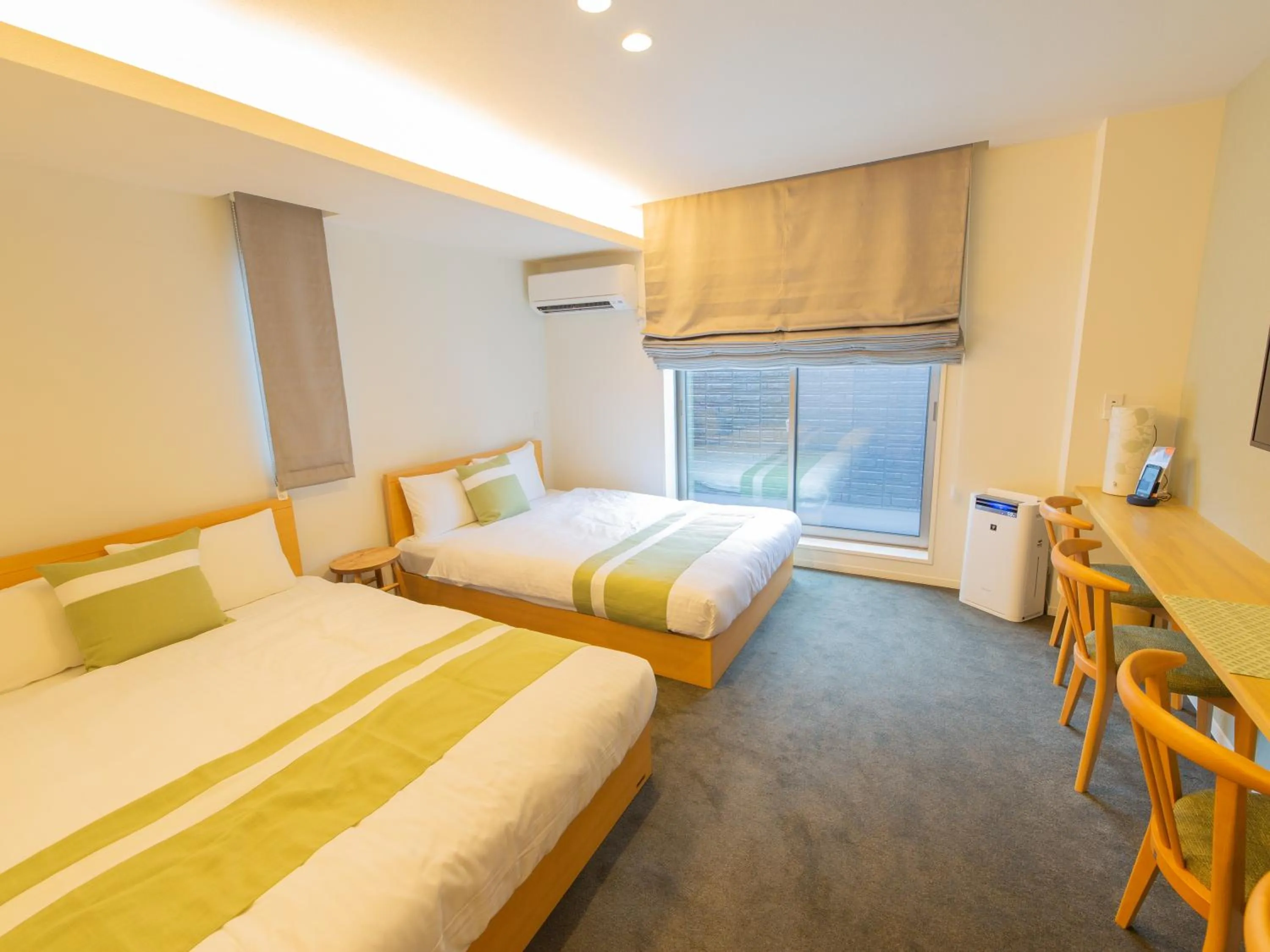 Photo of the whole room, Bed in GRAND BASE Hiroshima Ekimae