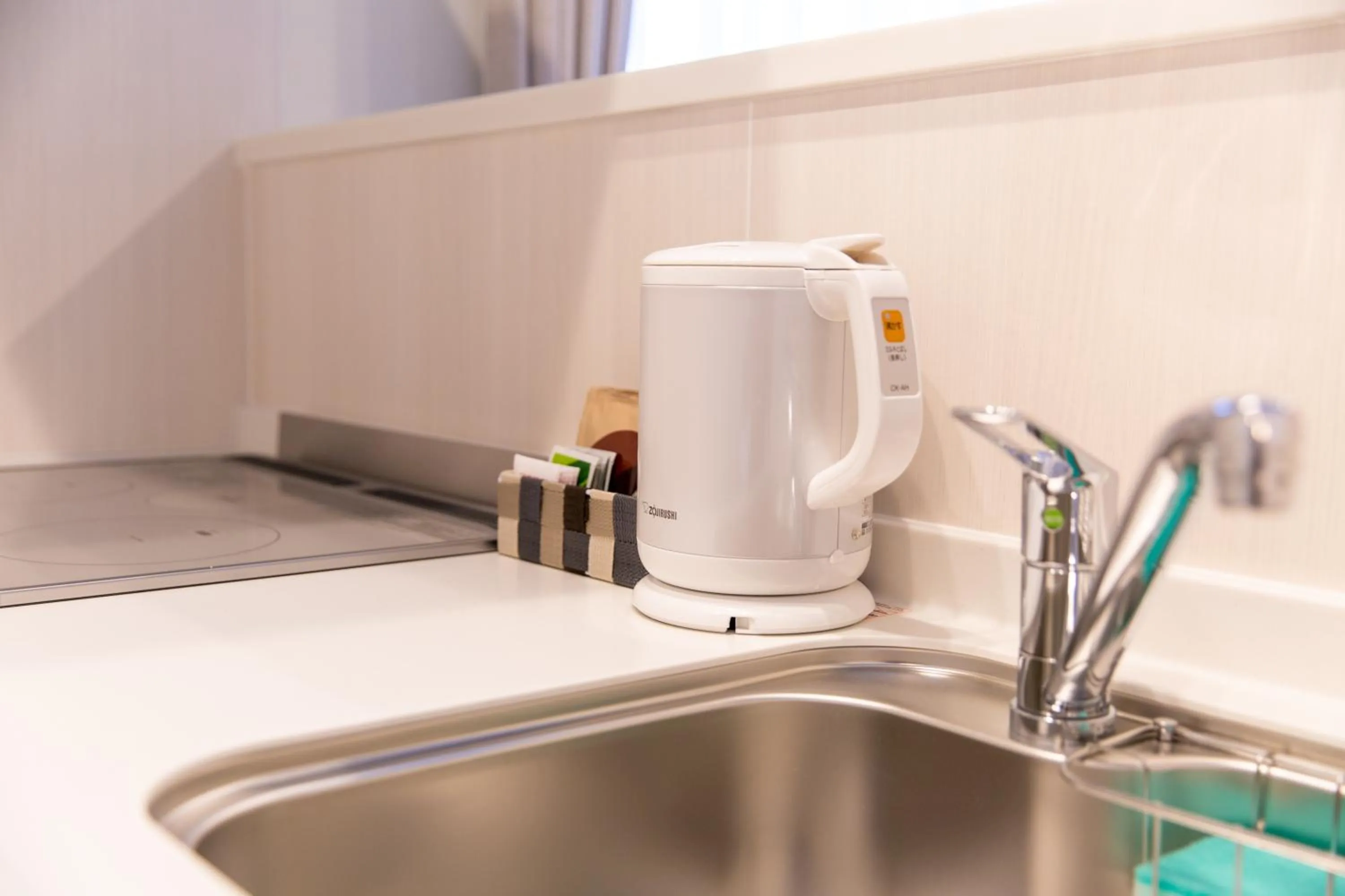 Kitchen or kitchenette in GRAND BASE Hiroshima Ekimae