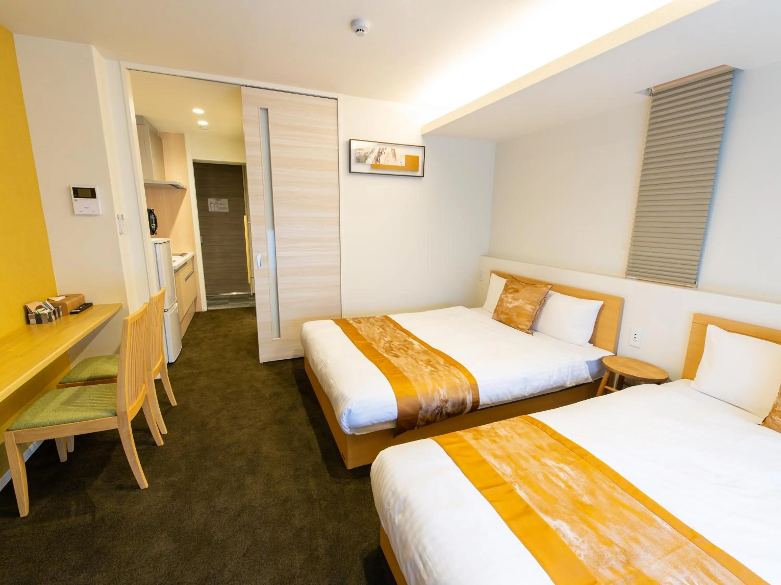Photo of the whole room, Bed in GRAND BASE Hiroshima Ekimae