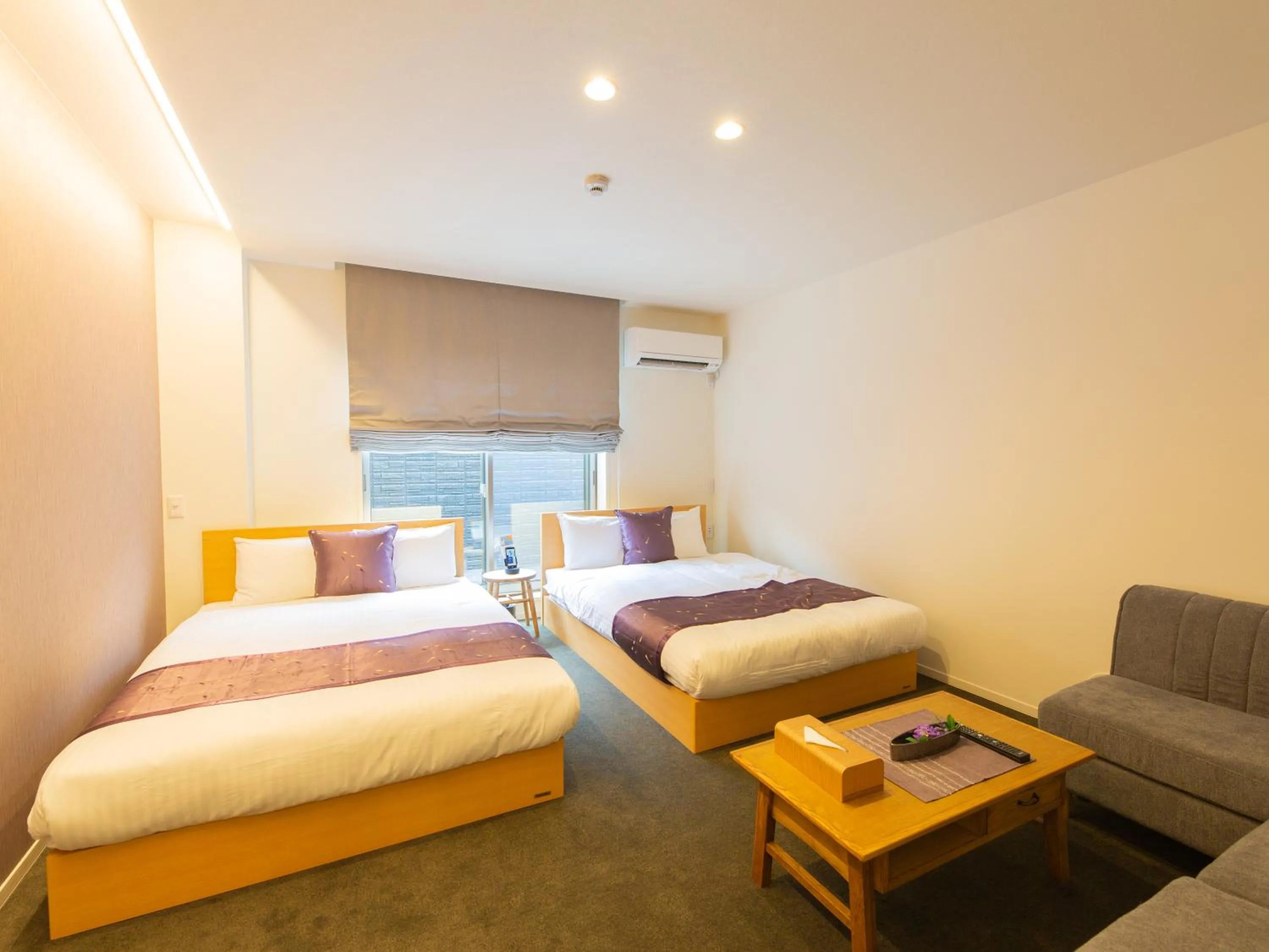 Photo of the whole room, Bed in GRAND BASE Hiroshima Ekimae