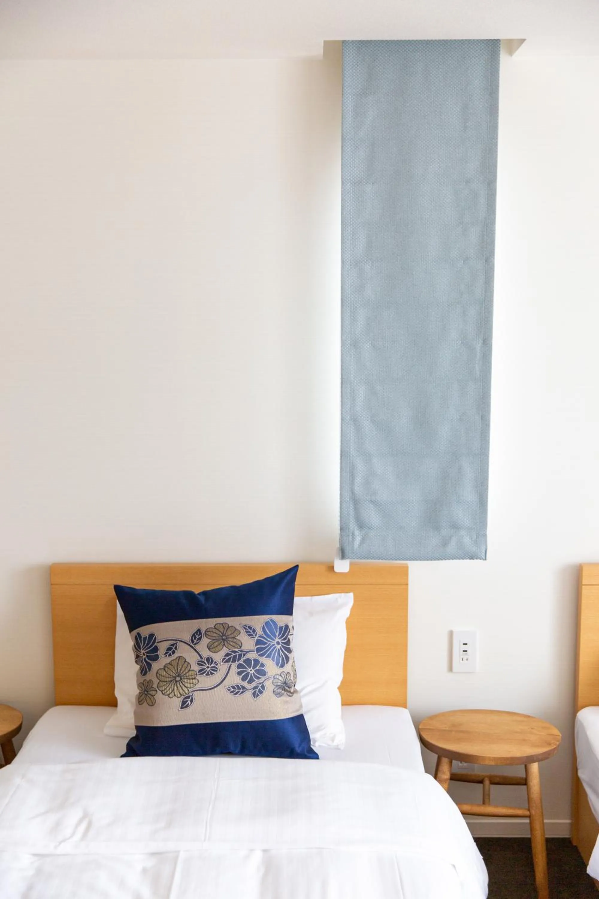 Bed in GRAND BASE Hiroshima Ekimae