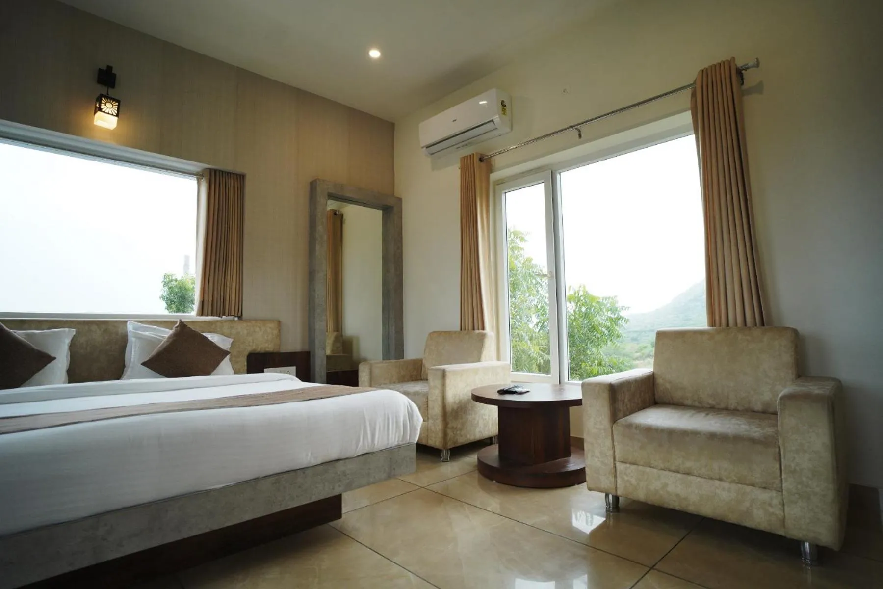 Seating area, Bed in Amar Bagh Resort