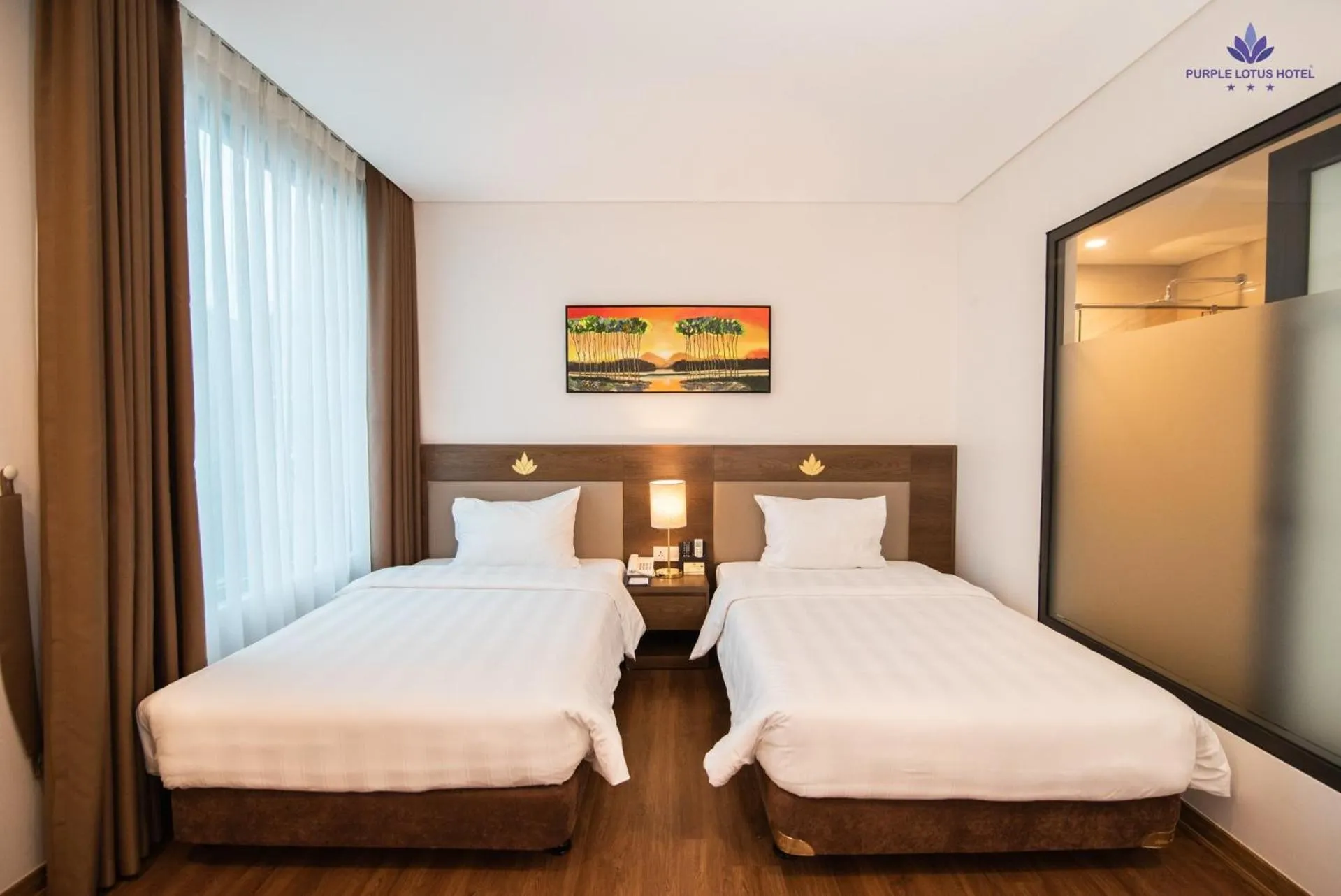 Bed in Purple Lotus Hotel