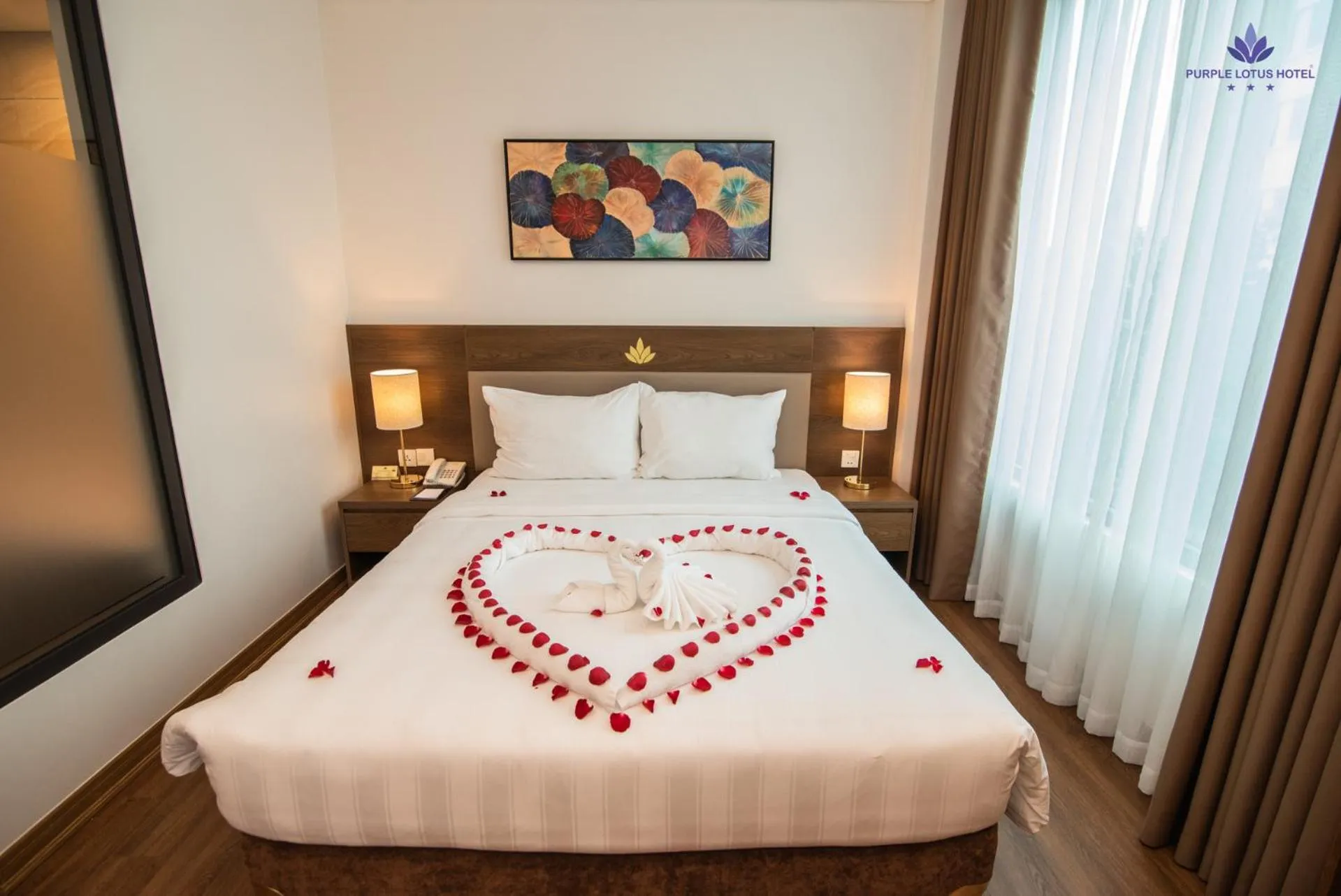 Bed in Purple Lotus Hotel