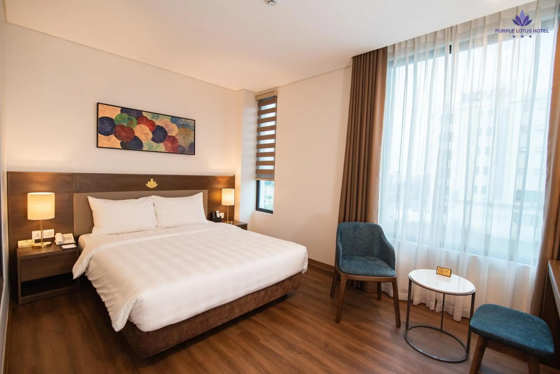 Bed in Purple Lotus Hotel