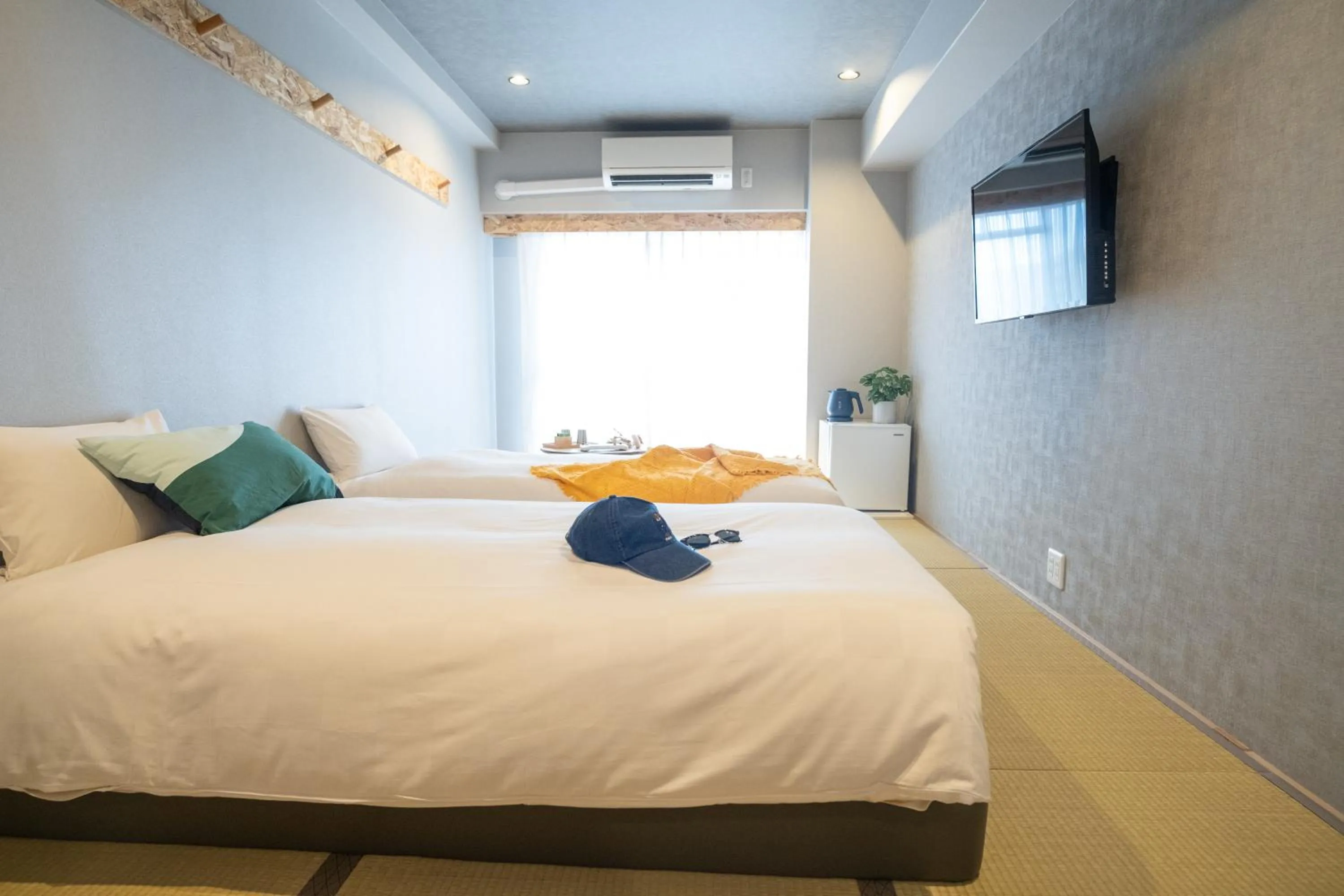 Bed in WAYFARER Kyoto Shijo