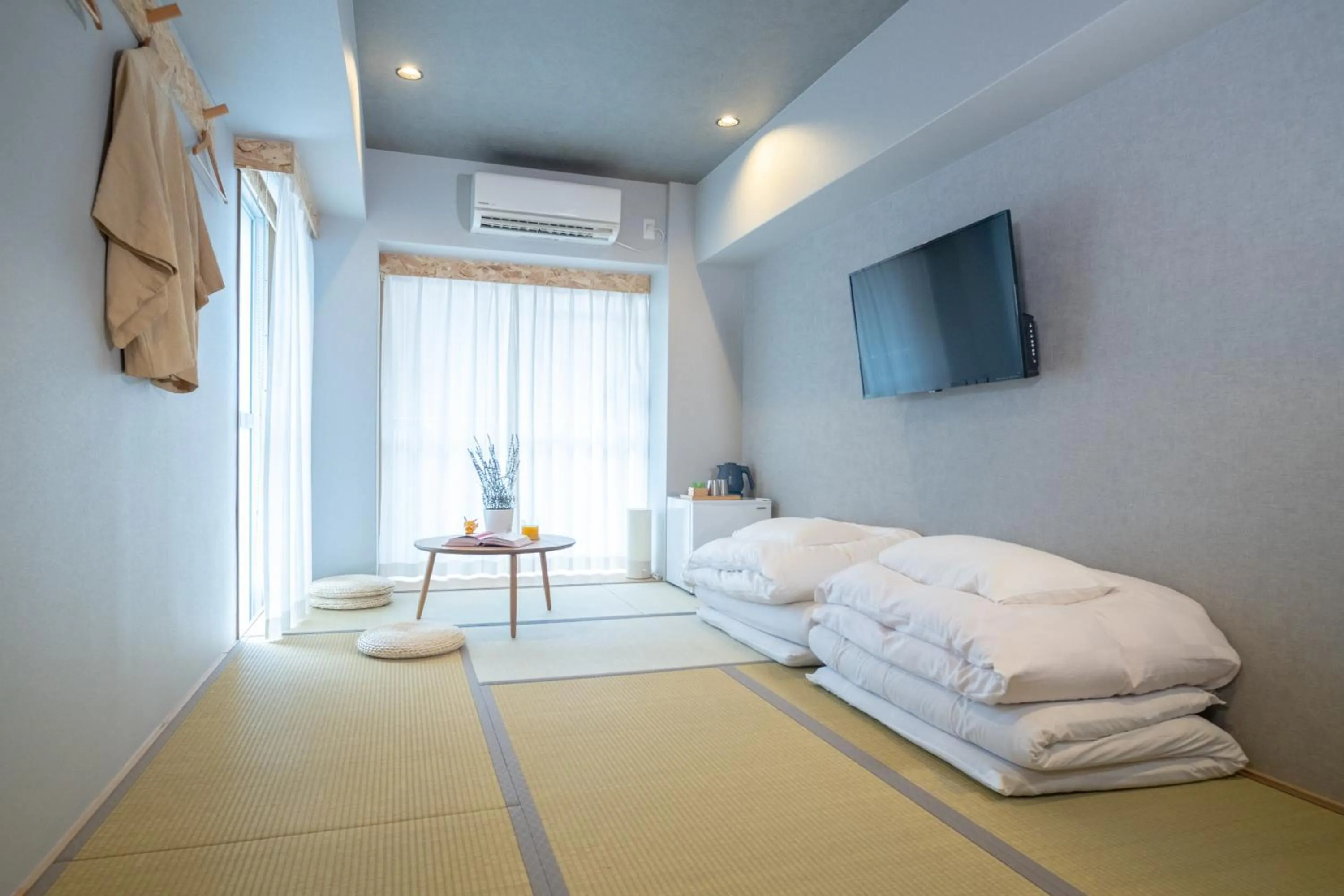 Bed in WAYFARER Kyoto Shijo