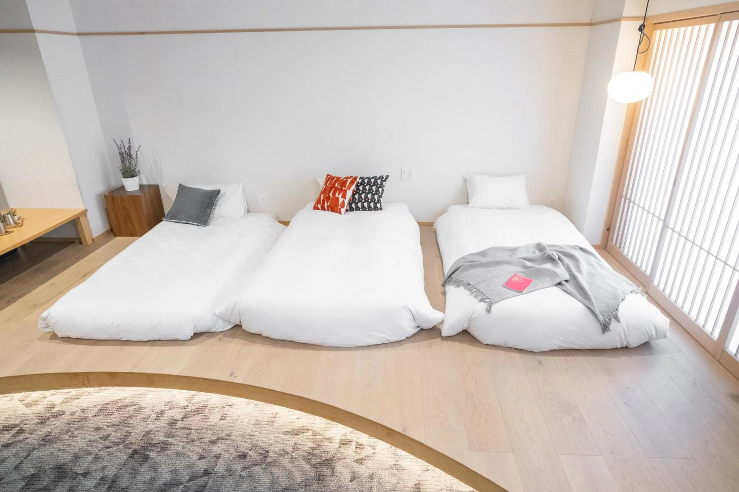 Bed in WAYFARER Kyoto Shijo