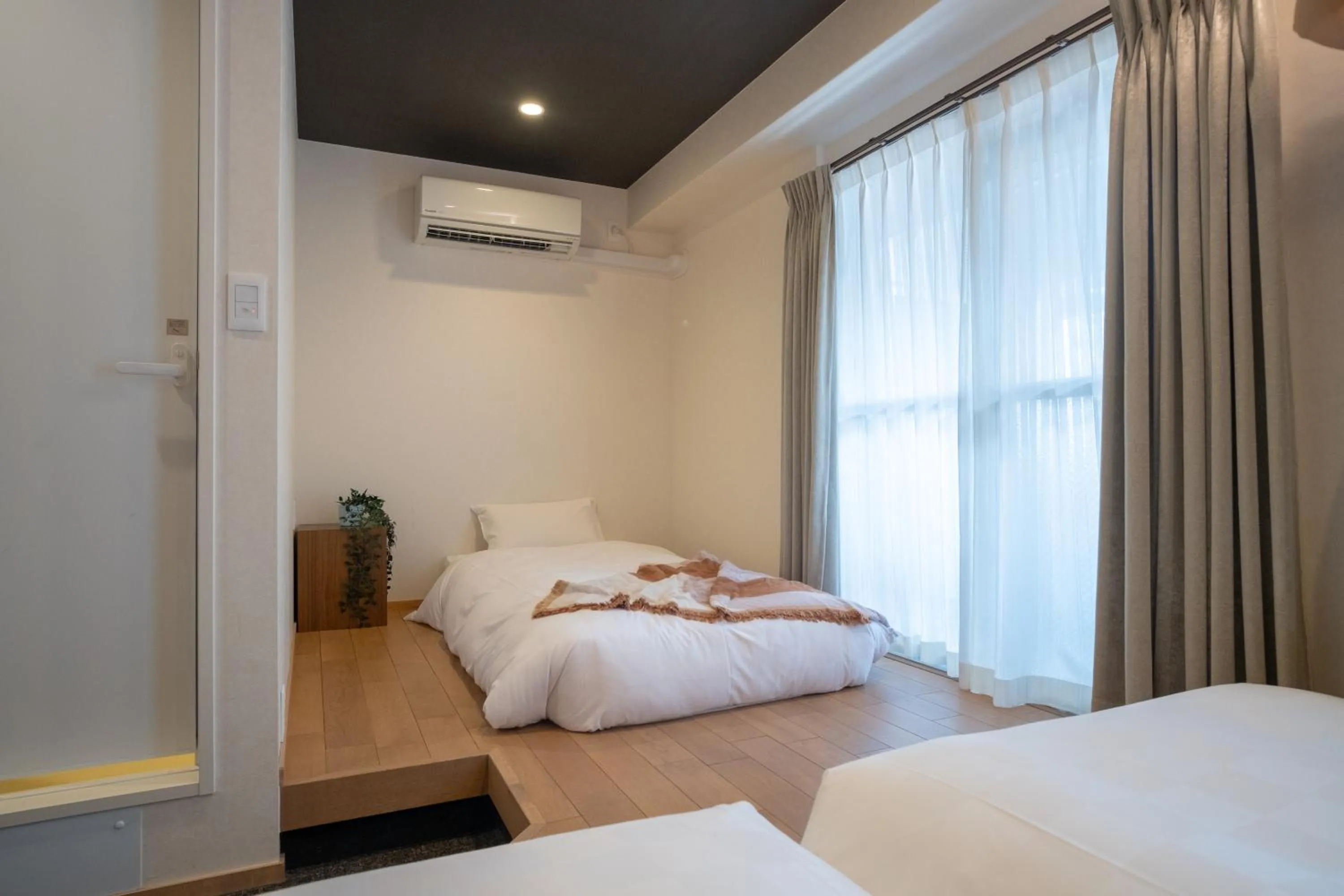 Bed in WAYFARER Kyoto Shijo