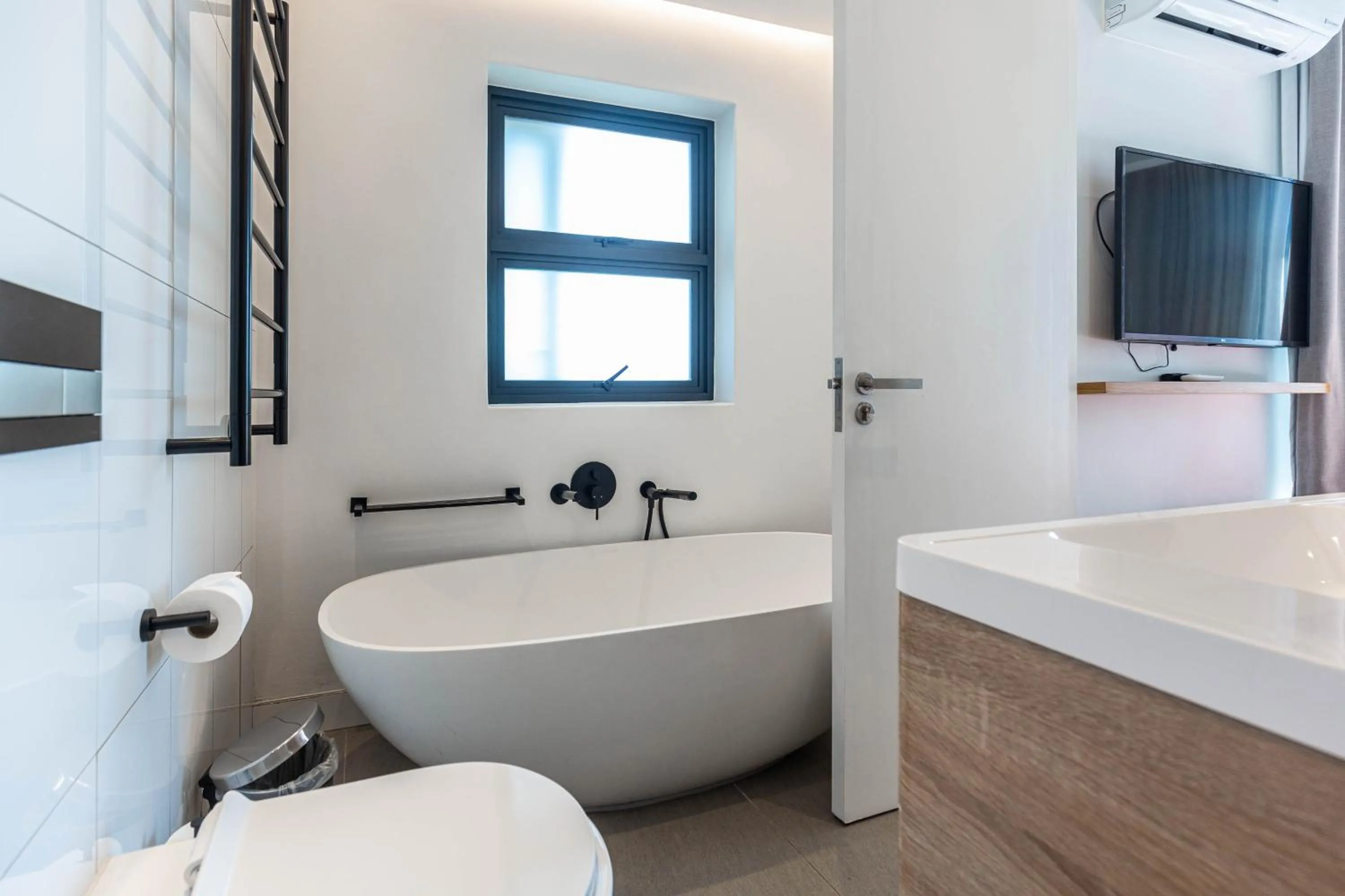 Bathroom in Latitude Aparthotel by Totalstay