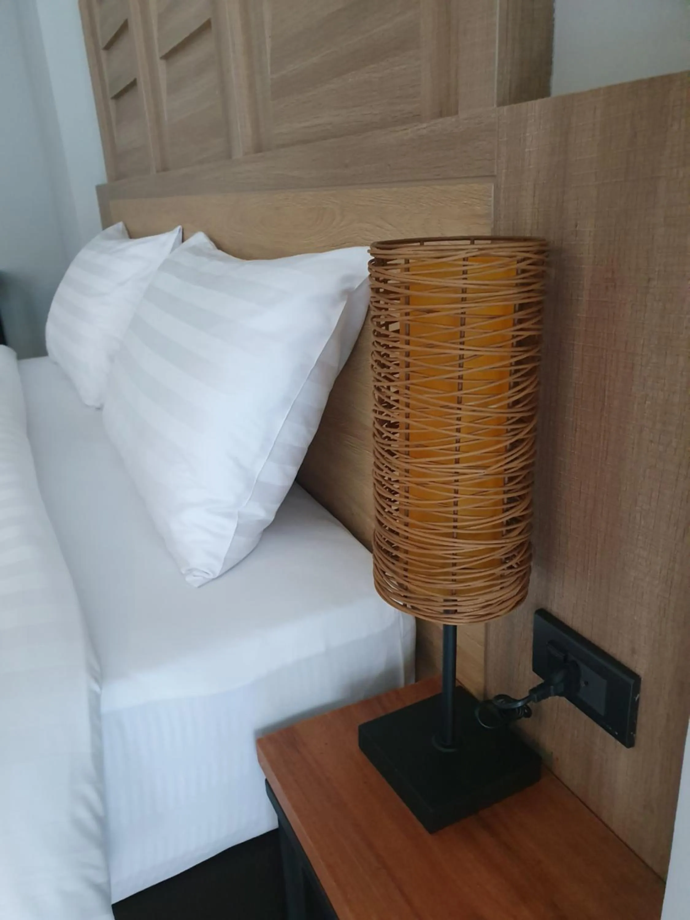 Bed in Atom Phuket Hotel