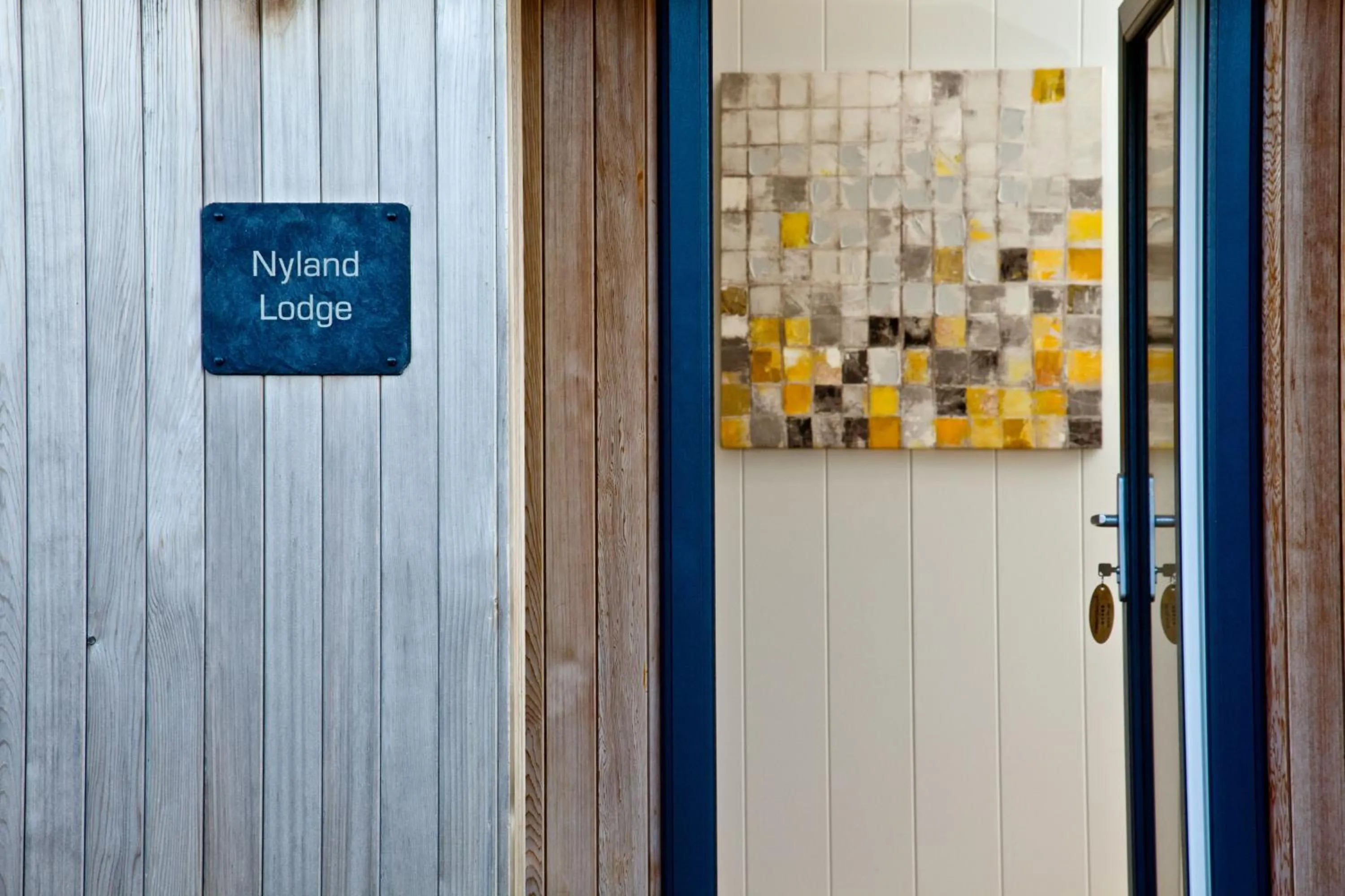 Property logo or sign in Nyland Lodge - Hot Tub - Fireplace - Free Parking & WiFi