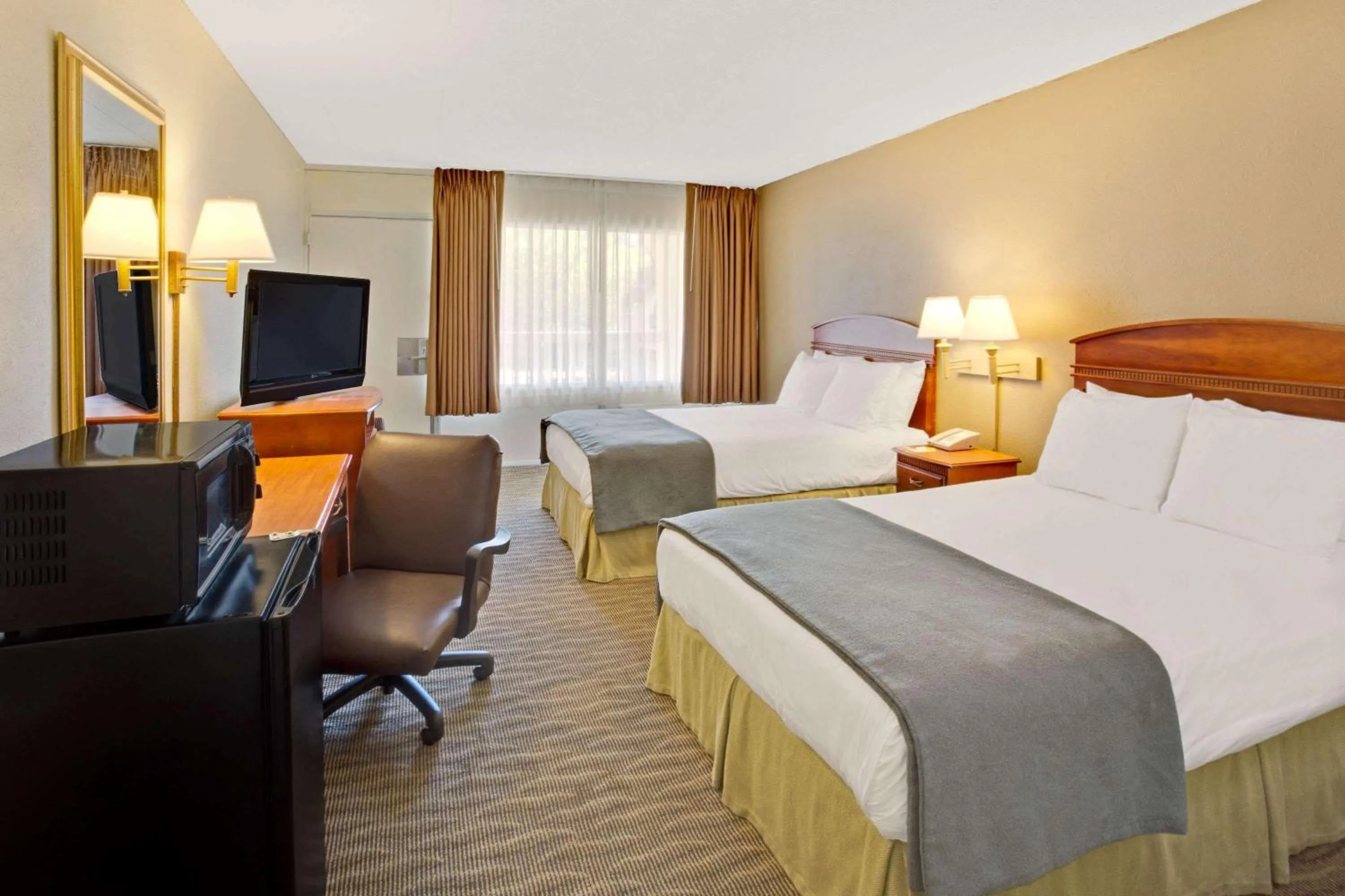 Photo of the whole room, Bed in Days Inn by Wyndham Silver Spring