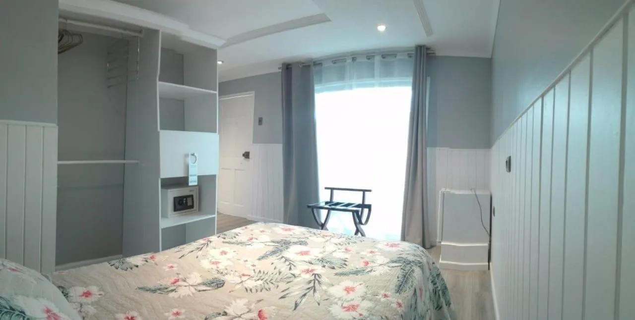 Photo of the whole room, Bed in Inaki Uhi Hotel