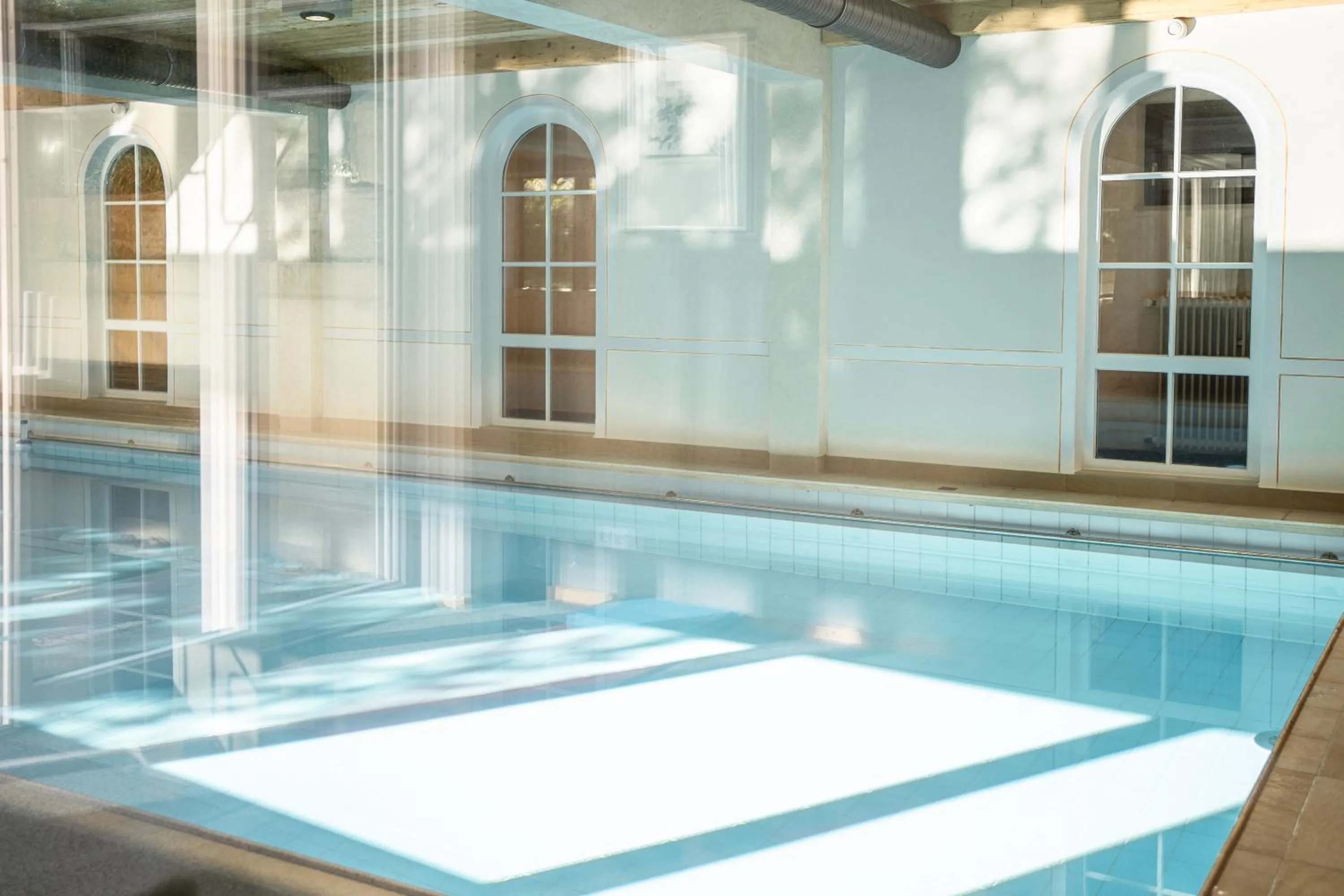 Swimming pool in Interest Vitalhotel - Partnerbetrieb von Oberstaufen PLUS
