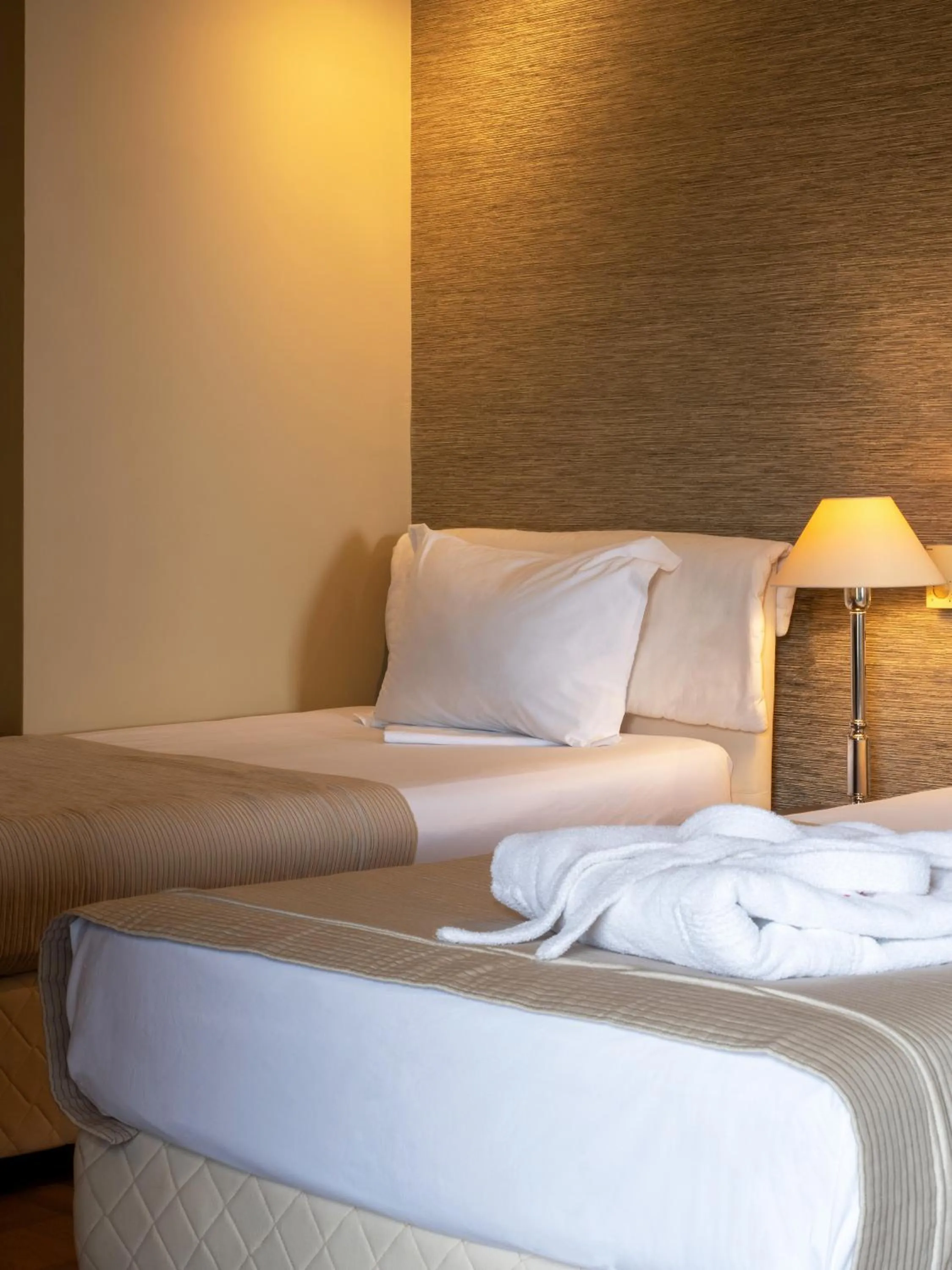 Bed in Rapo's Resort Hotel