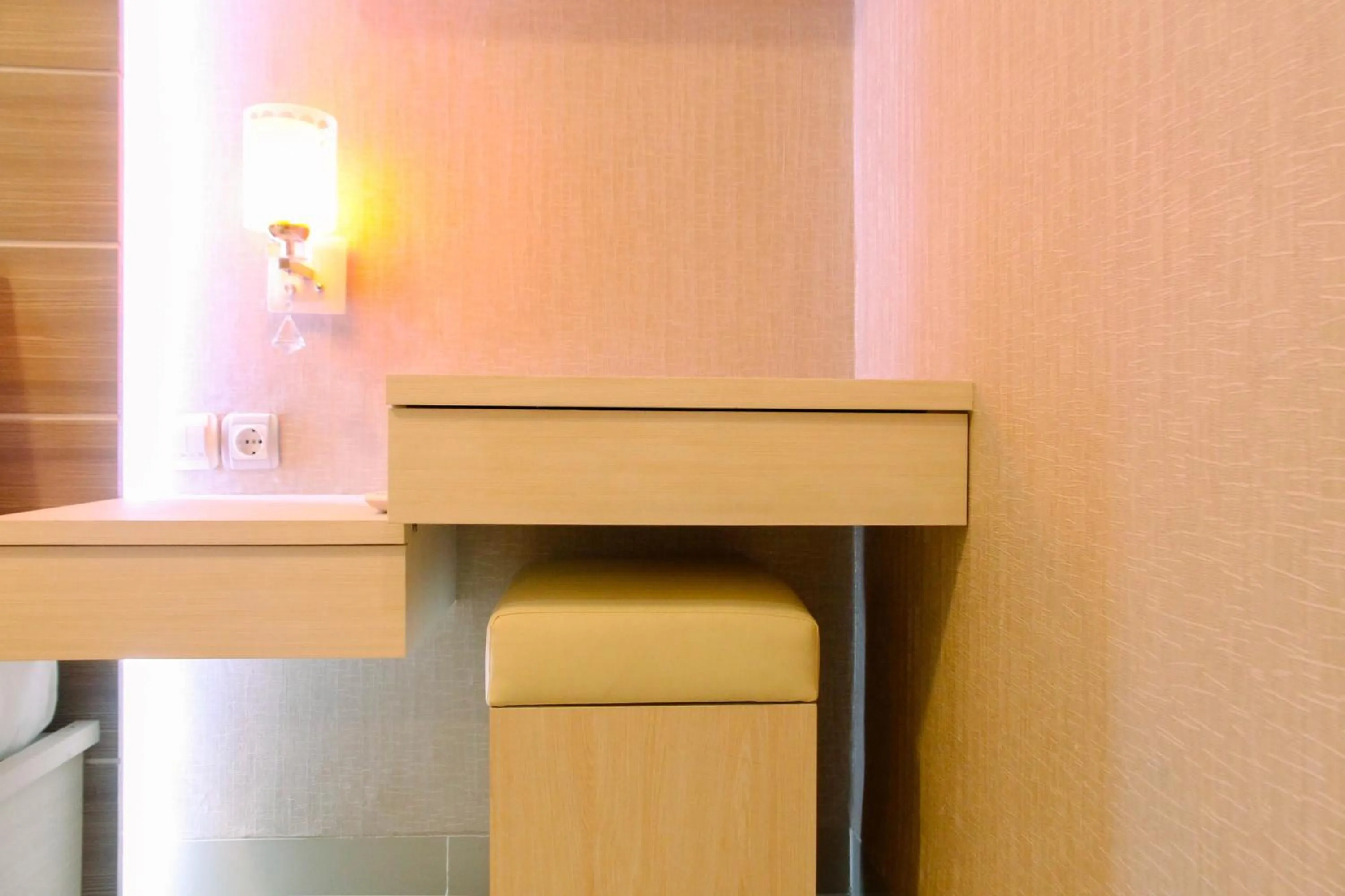 Bedroom in Best Price 1BR Apartment at The Oasis Cikarang By Travelio