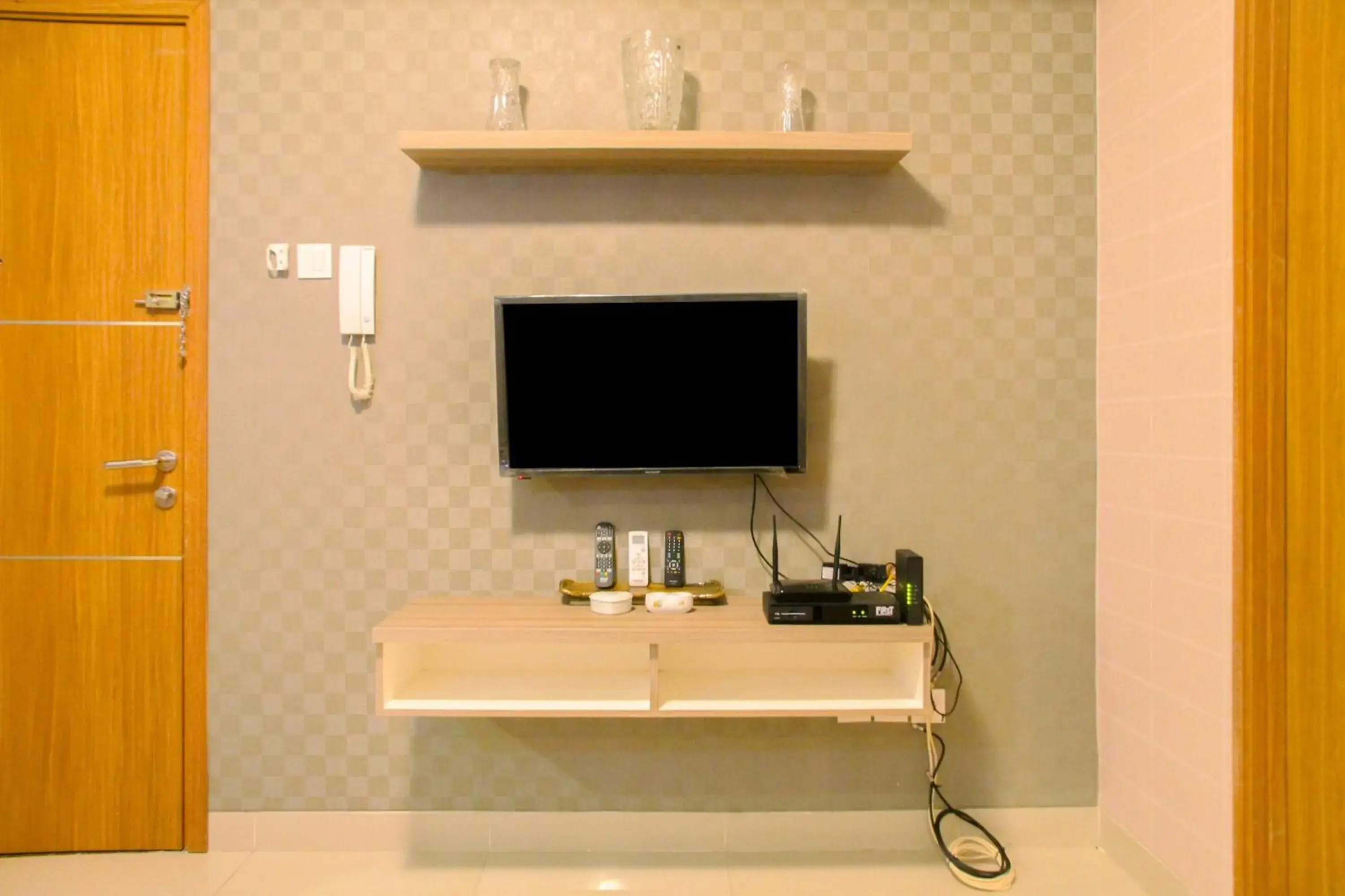 Living room in Best Price 1BR Apartment at The Oasis Cikarang By Travelio Living room in Best Price 1BR Apartment at The Oasis Cikarang By Travelio