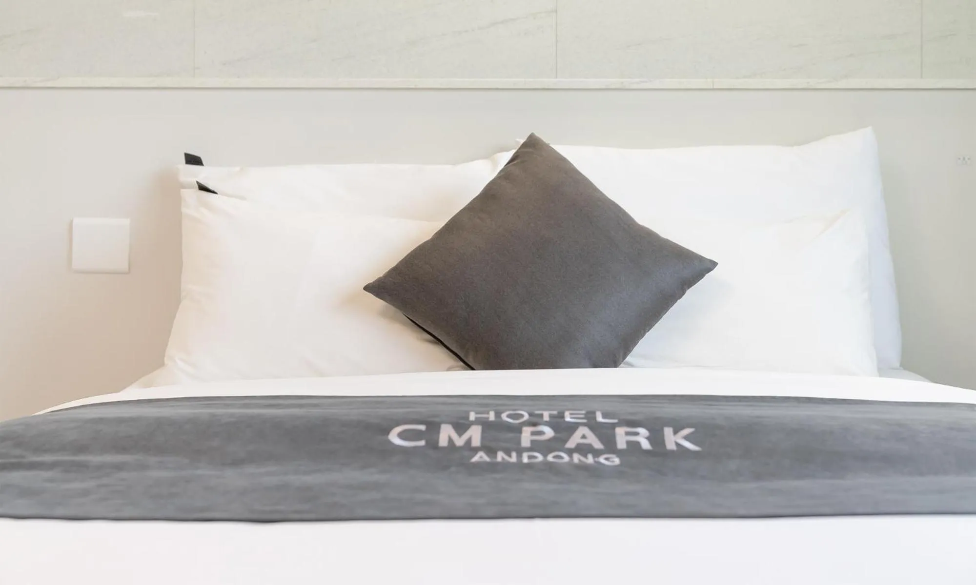 Bed in CM Park Hotel