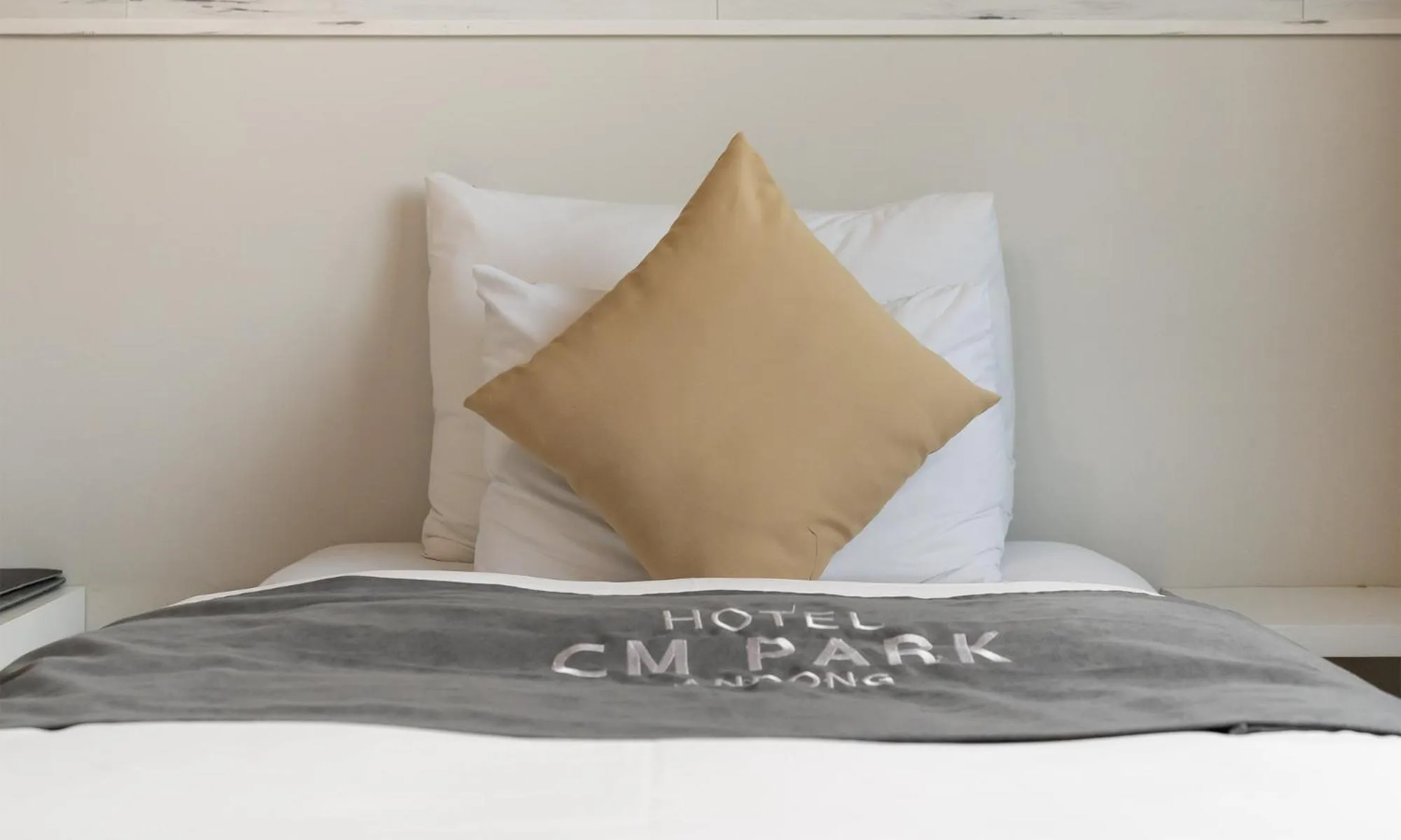 Bed in CM Park Hotel