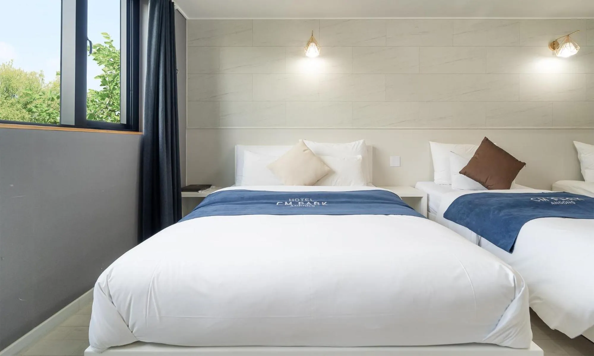 Bed in CM Park Hotel