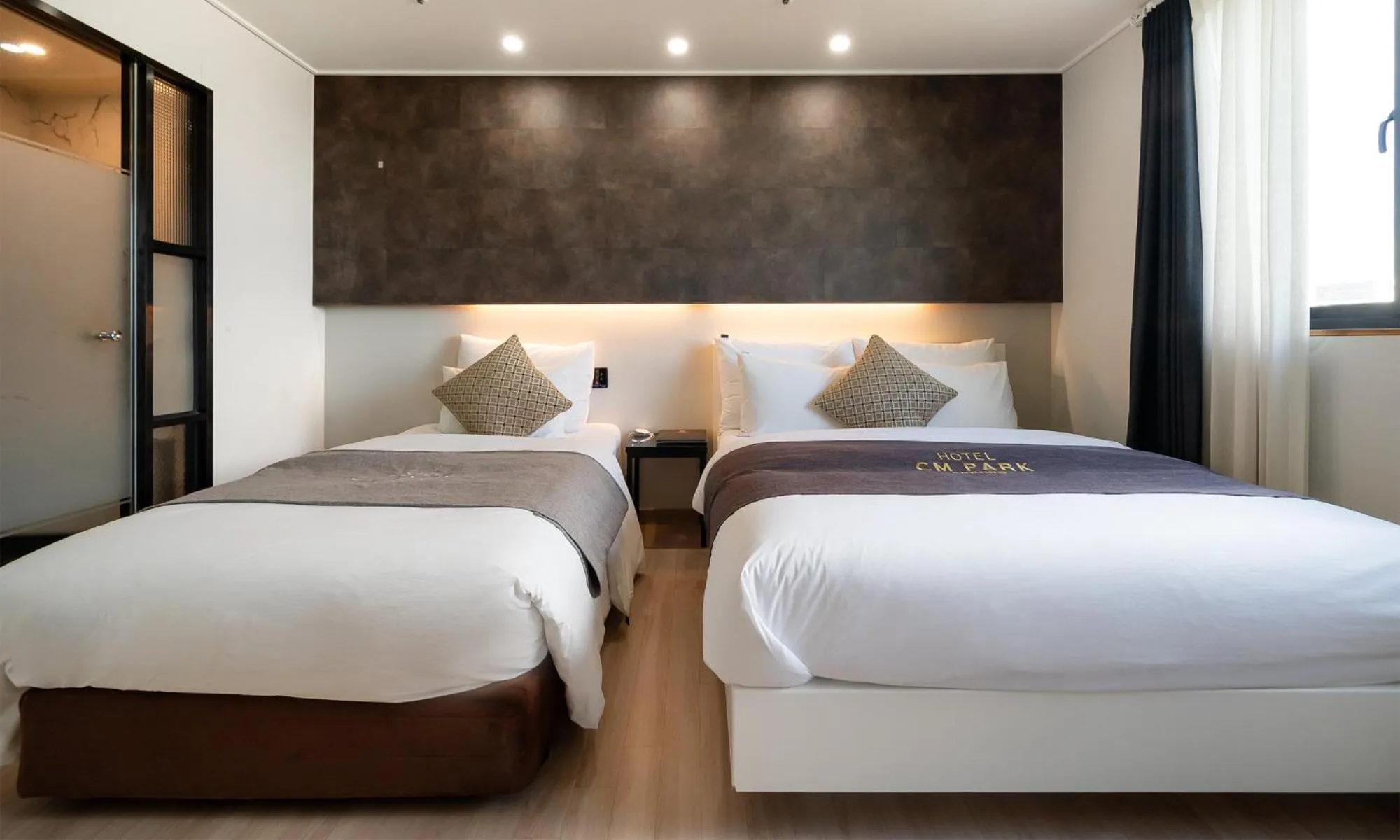 Bed in CM Park Hotel