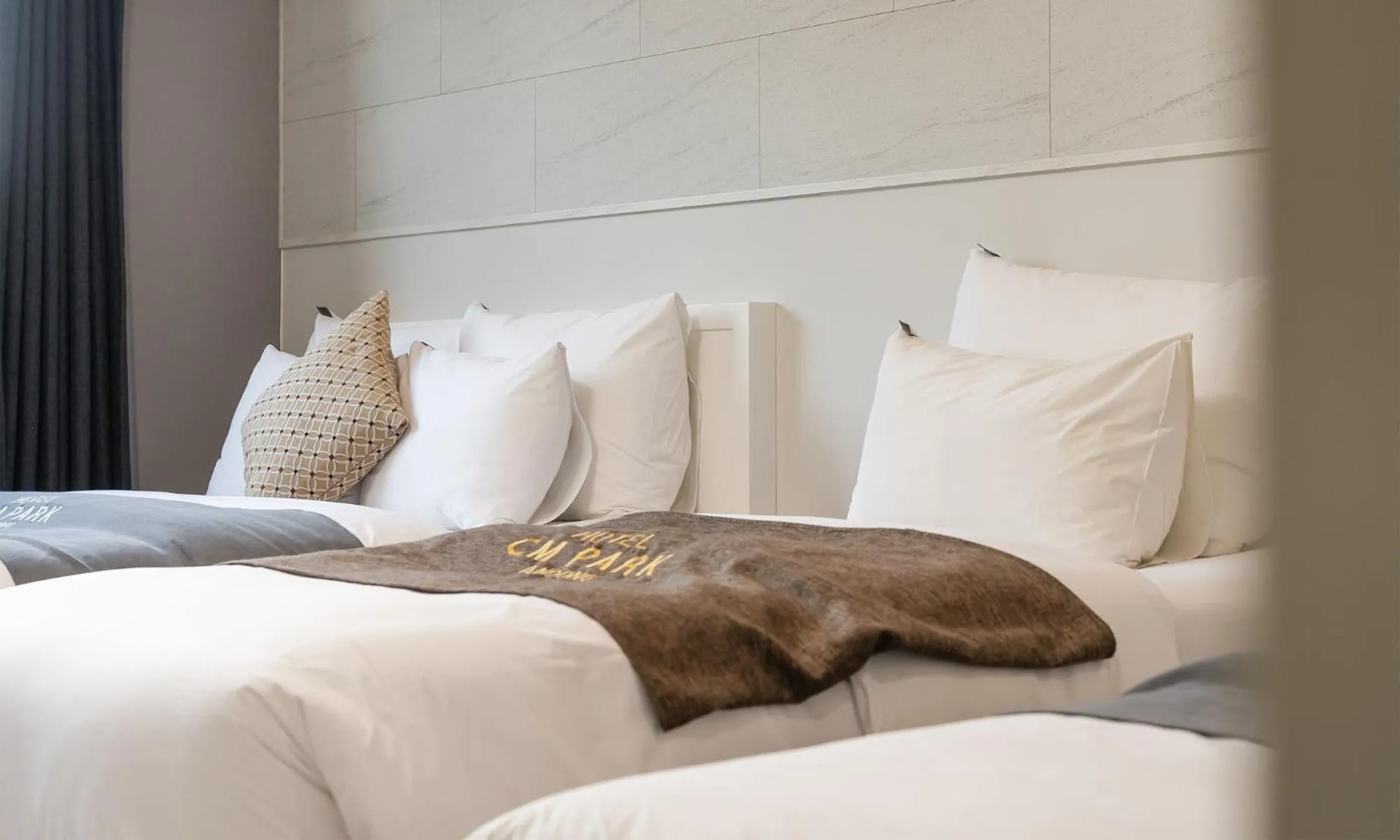 Bed in CM Park Hotel