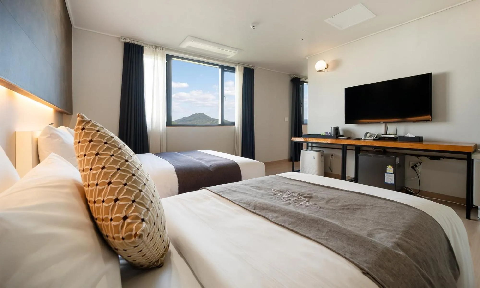 Bed in CM Park Hotel