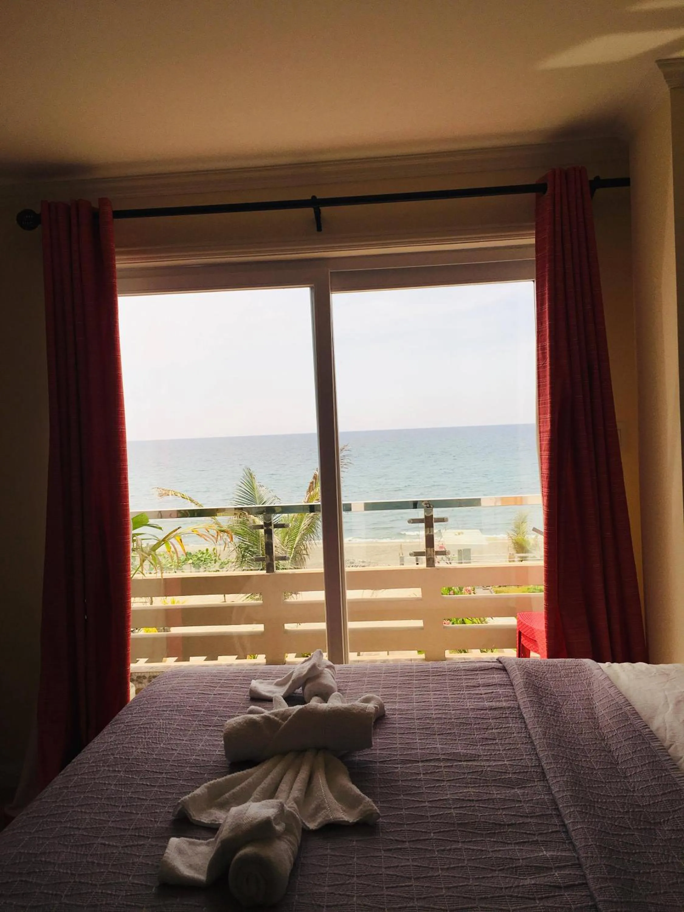 Balcony/Terrace, Bed in EM Royalle Hotel & Beach Resort