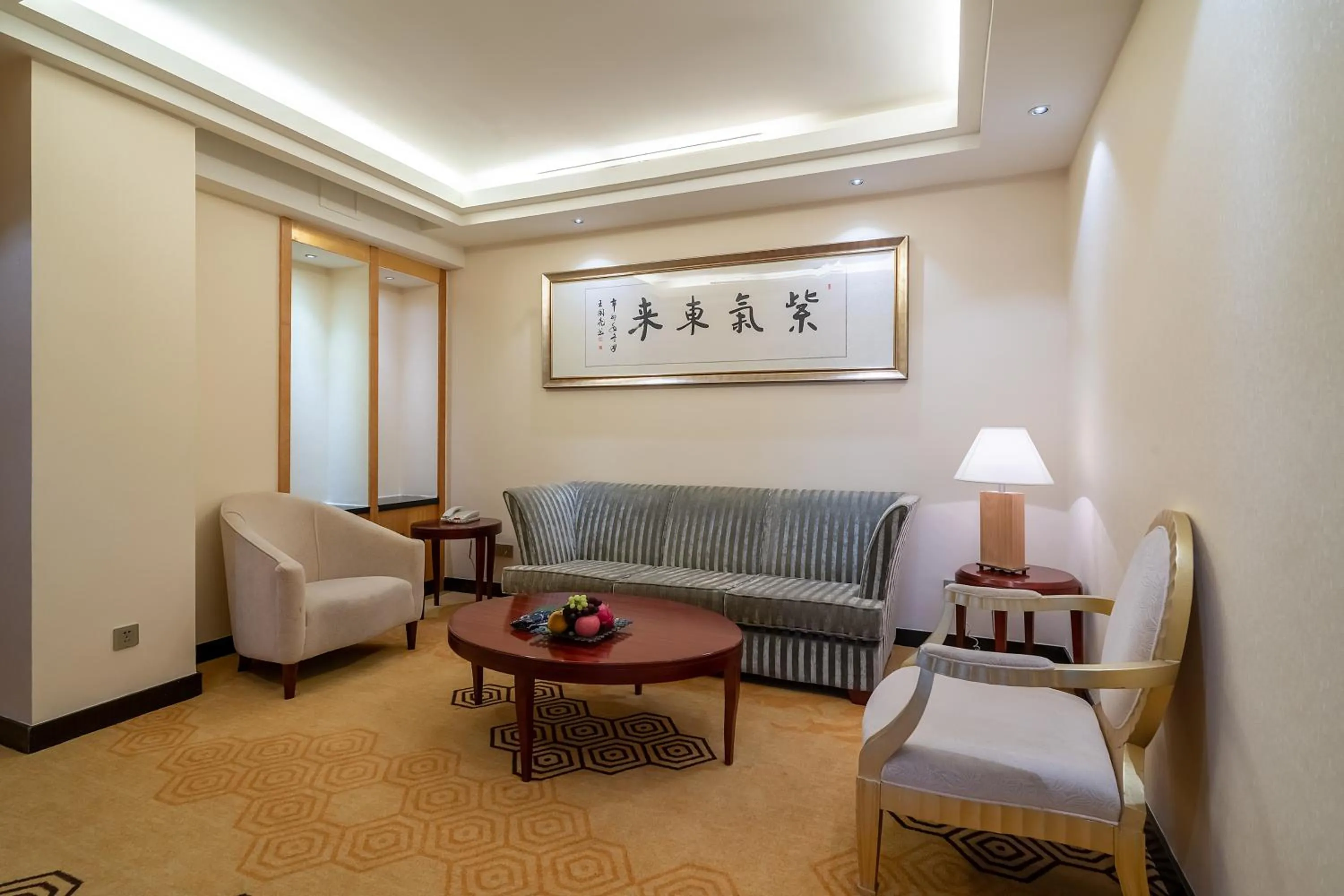 Living room in Ramada Plaza By Wyndham Taian