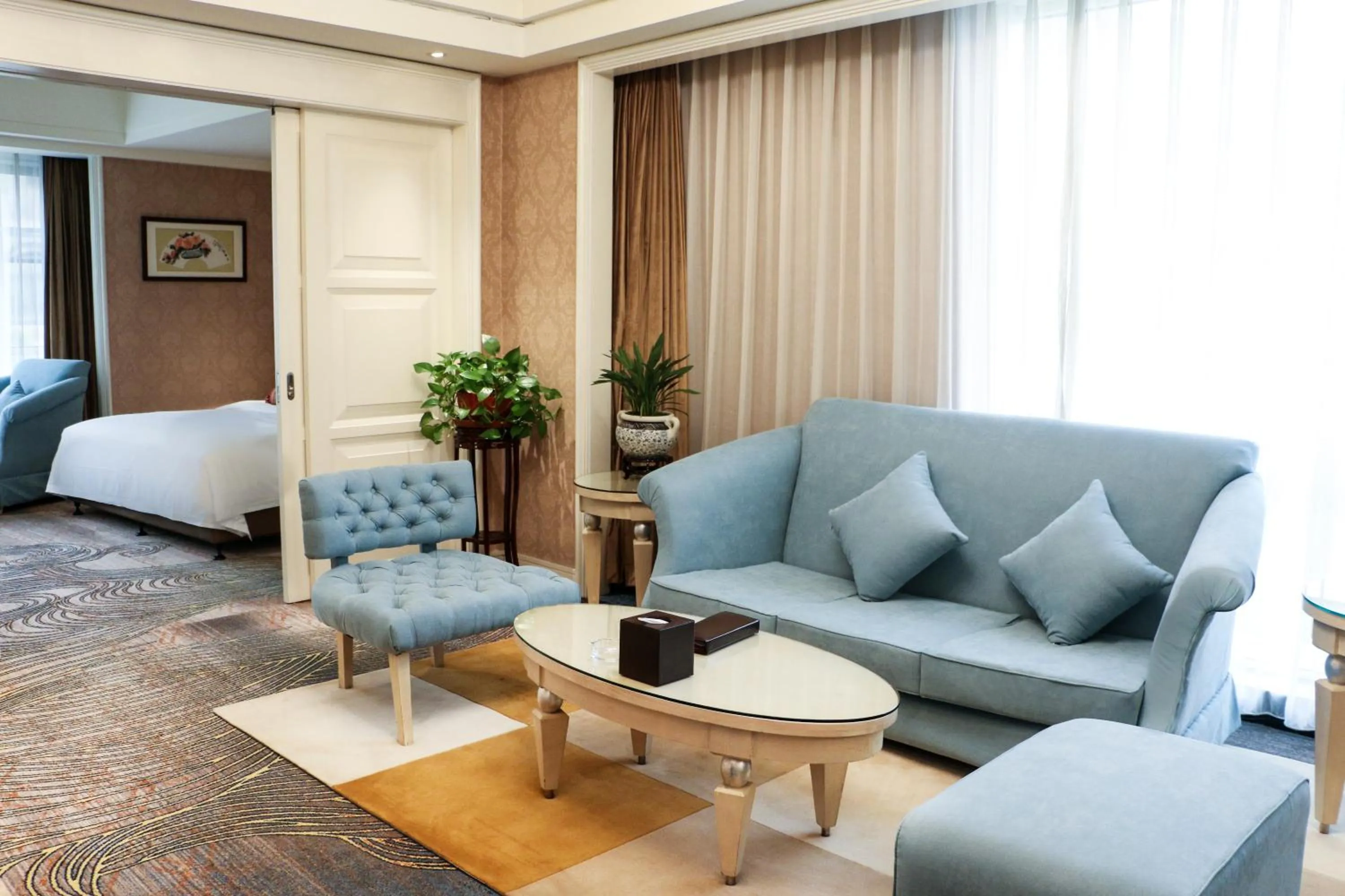 Living room in Ramada Plaza By Wyndham Taian